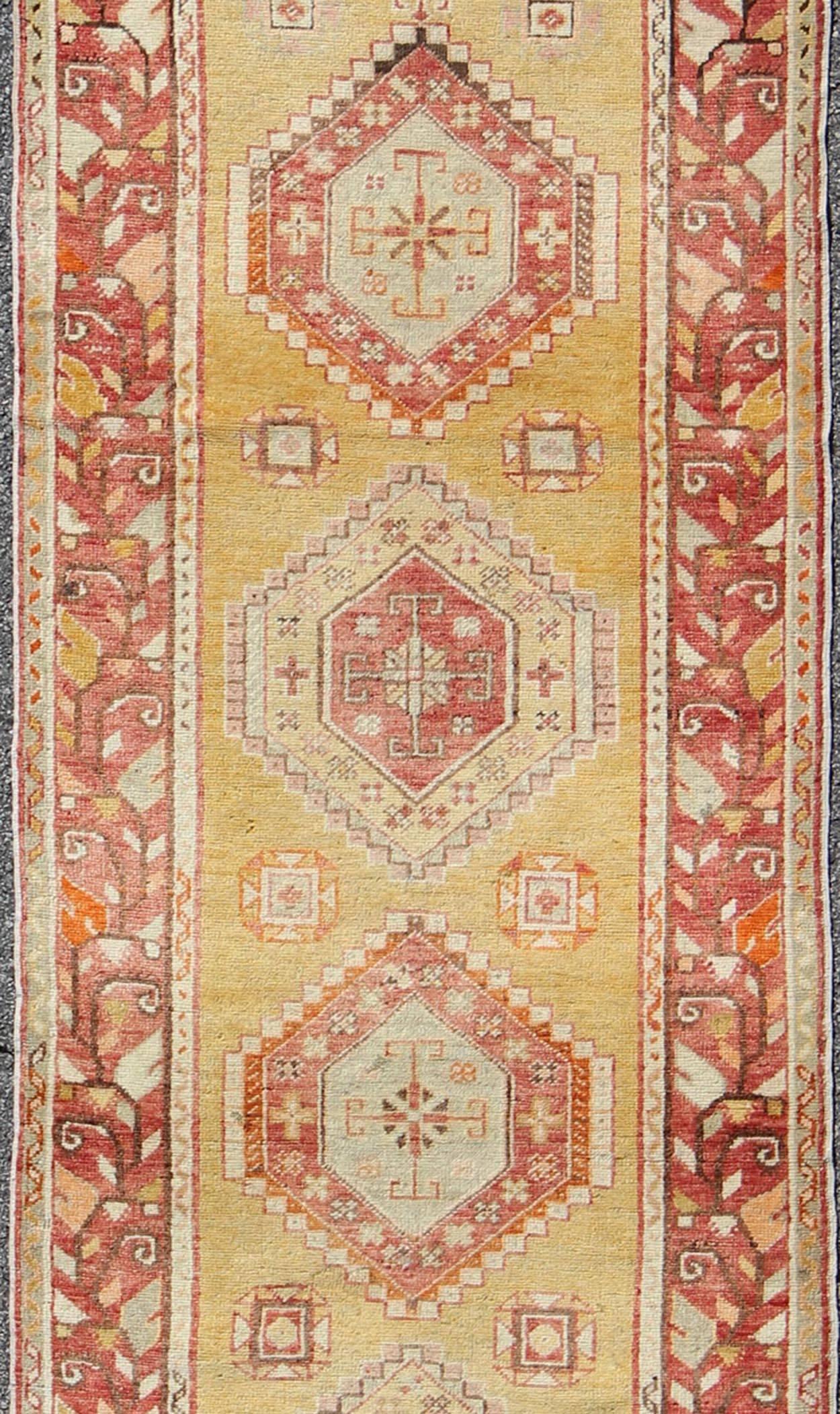 Early 20th Century Antique Turkish Oushak Runner with Geometric Medallions in Yellow Background  For Sale