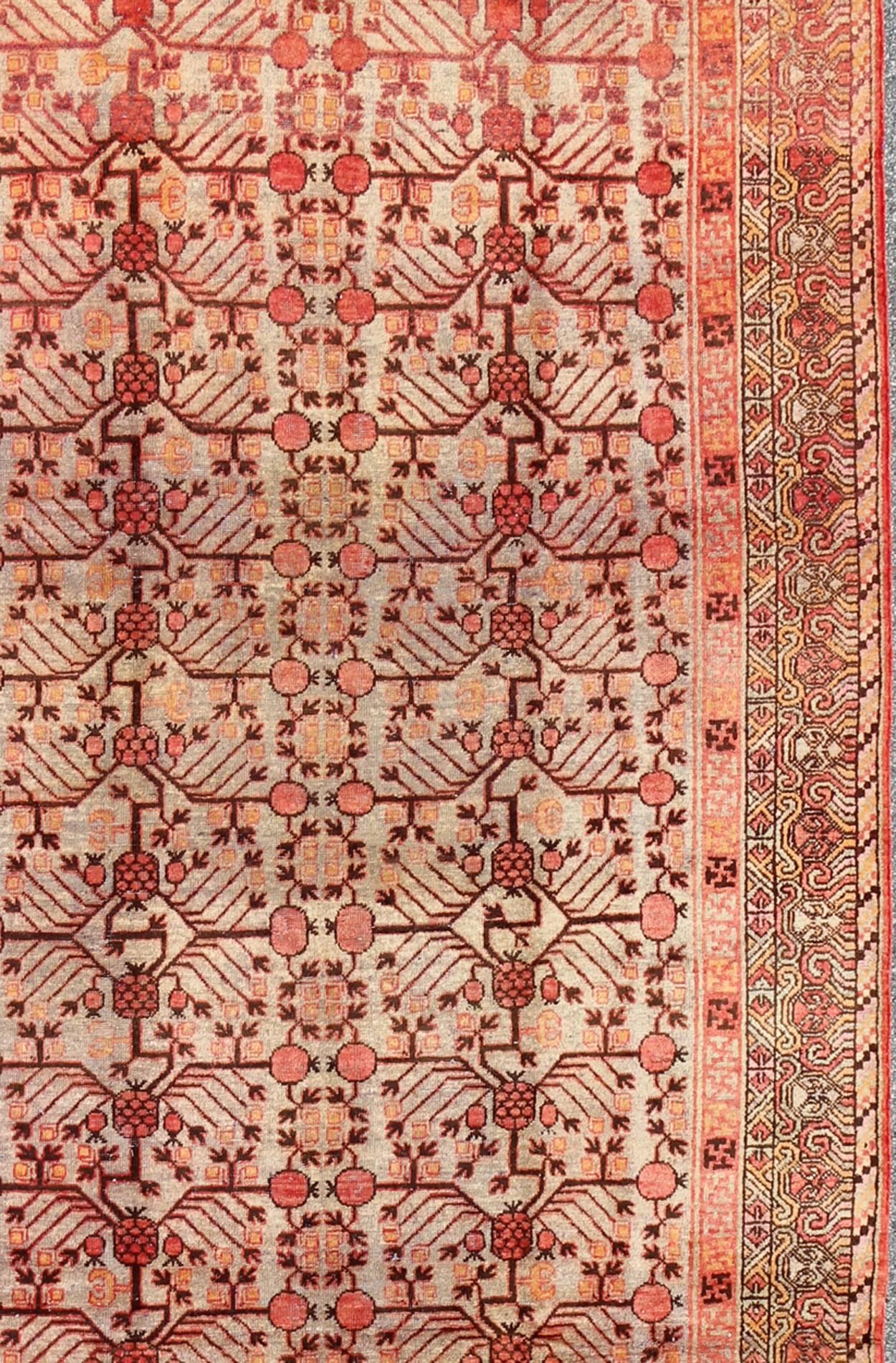 Large Khotan Antique Rug with Pomegranate Design in Taupe, Green, Red and Brown In Good Condition For Sale In Atlanta, GA