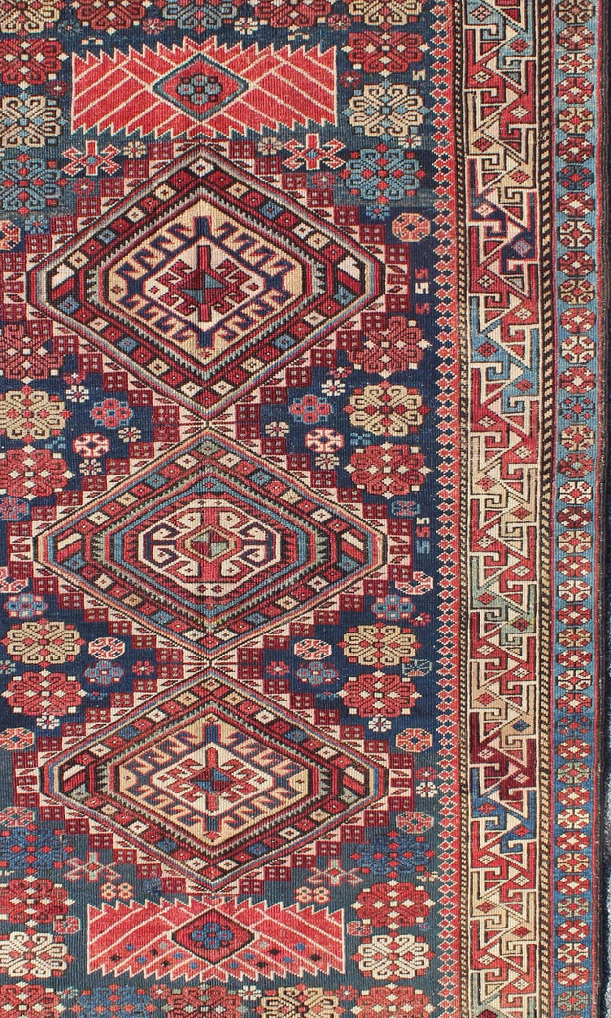 Russian Antique Kazak Rug with in Multi Colors and Indigo Background For Sale
