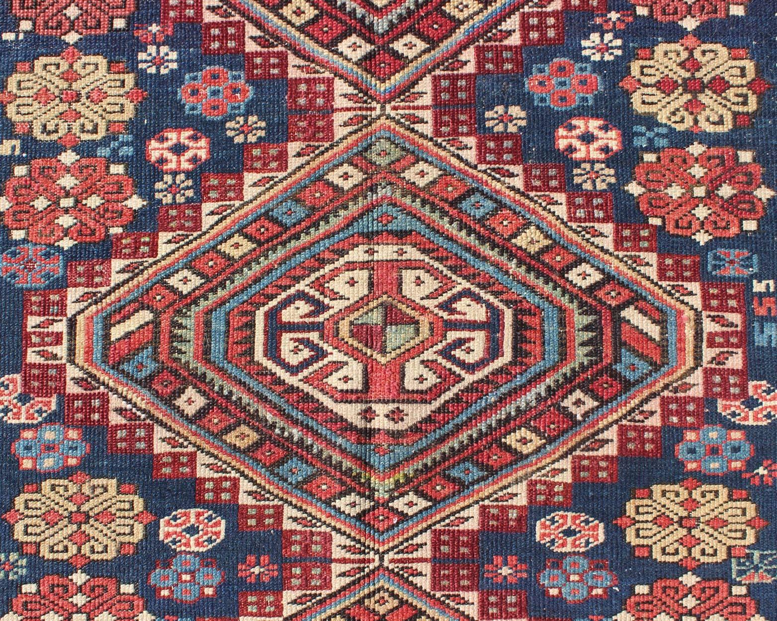 Antique Kazak Rug with in Multi Colors and Indigo Background In Good Condition For Sale In Atlanta, GA