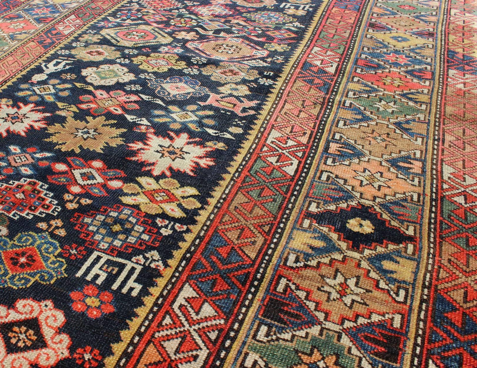 Caucasian Colorful Antique Kuba Carpet with Intricate Geometric Design For Sale