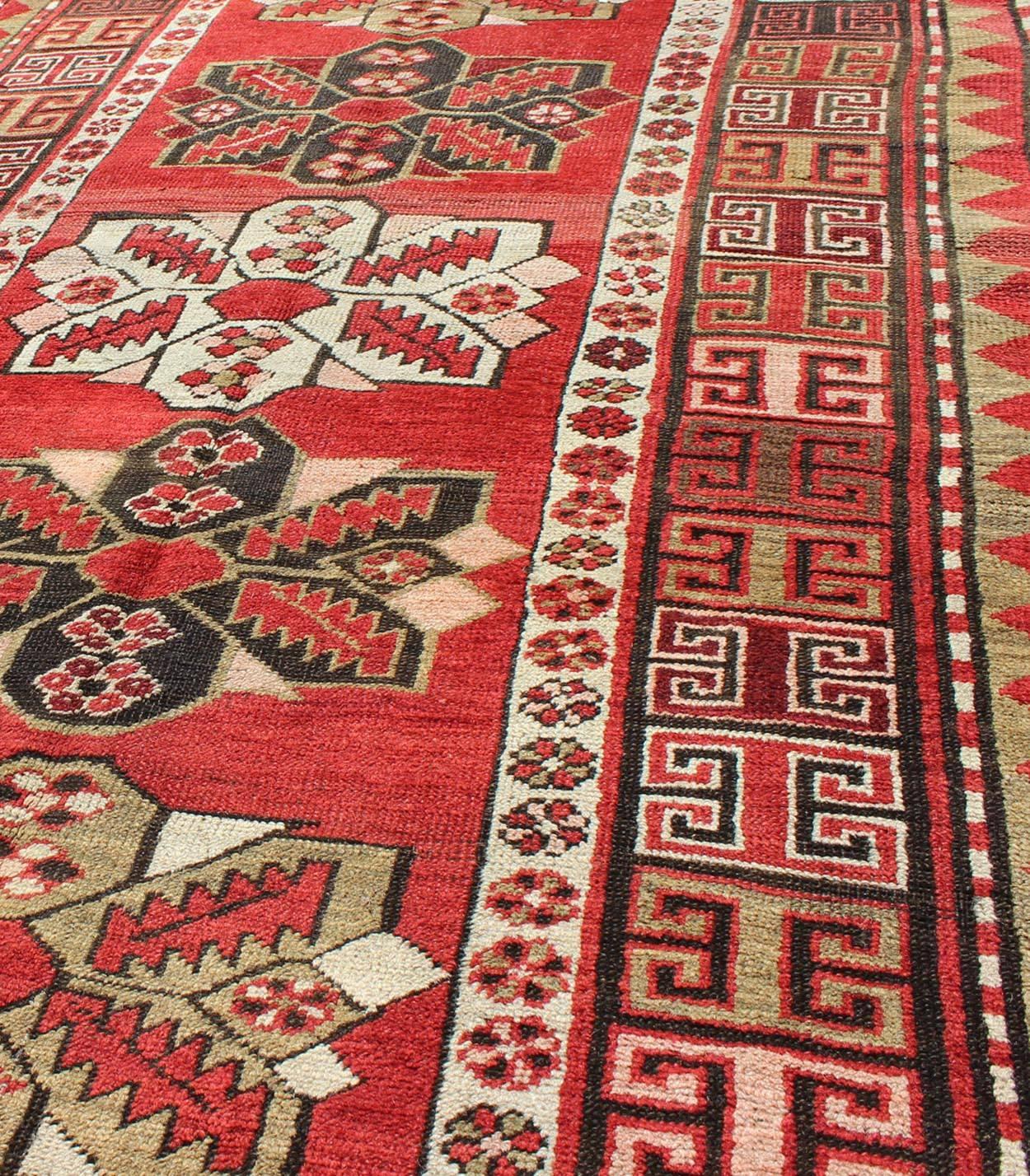 Caucasian Antique Kazak Runner with Medallions and Tribal Design in Red Background  For Sale