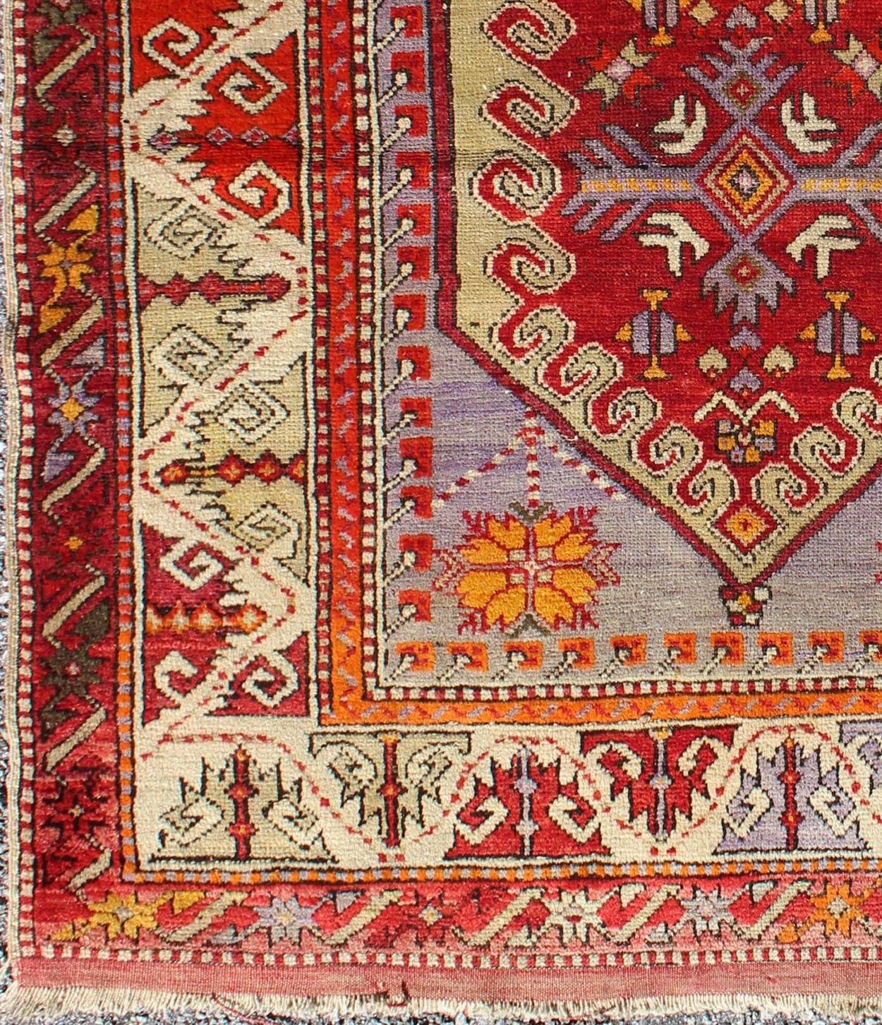 Colorful early 20th century antique Turkish Oushak rug with Medallion in Purple, rug j10-0402, country of origin / type: Turkey / Oushak, circa 1930

This antique Oushak rug features an intricate and complex design paired with a unique color
