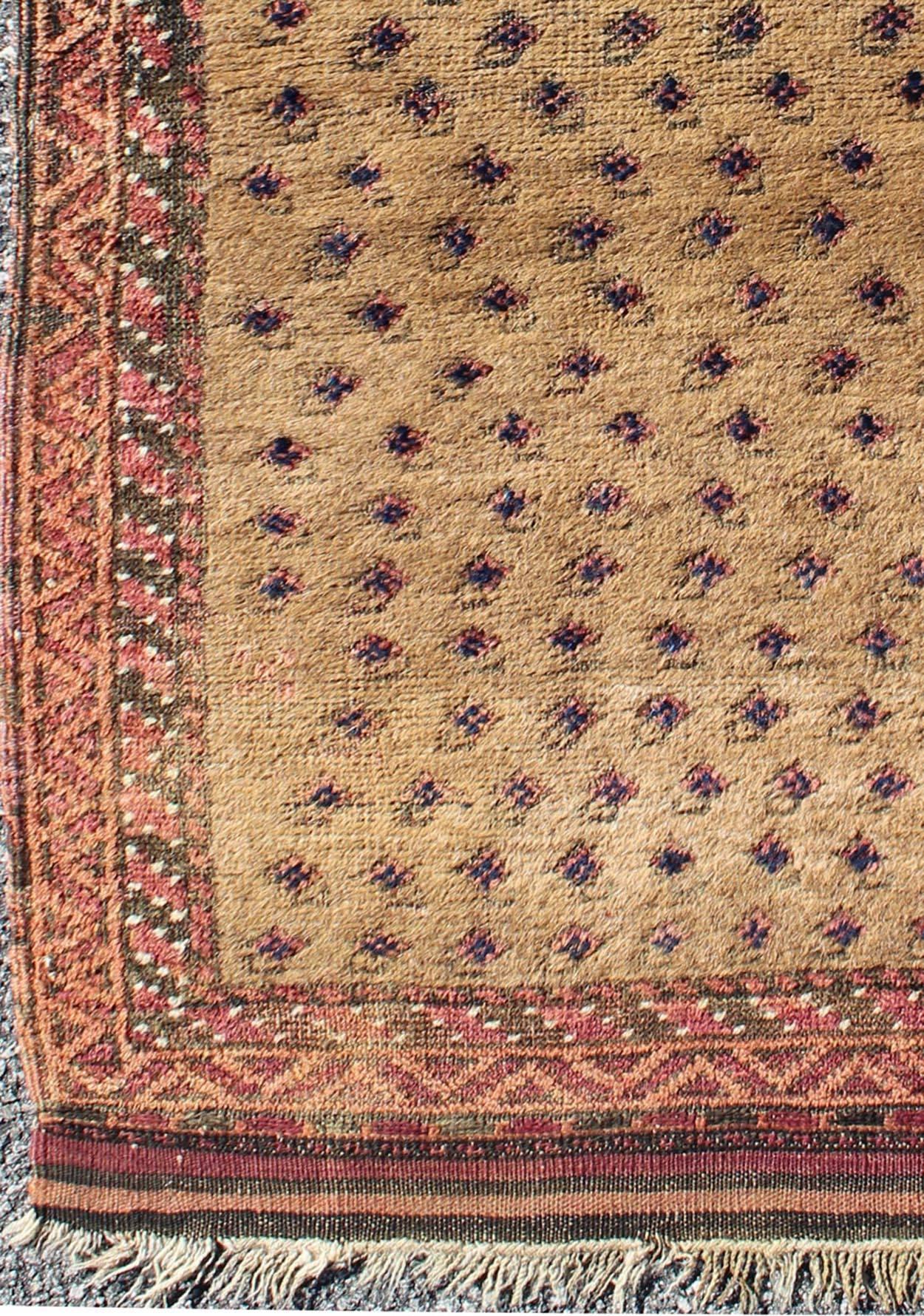 Tribal Afghan Antique Beluch Prayer Rug with All-Over Paisley Pattern in Camel, rug j10-0403, country of origin / type: Afghanistan / Tribal, circa 1900

This impressive and complex antique Afghan Beluch prayer rug (circa 1900) features an all-over