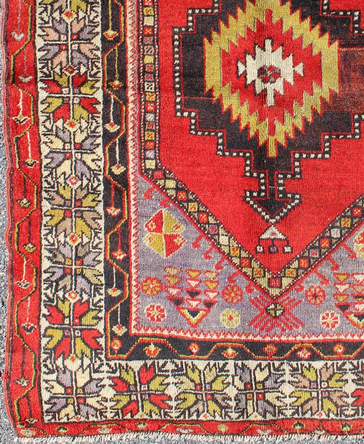 Early 20th century antique Oushak rug from Turkey with multicolored geometrics, Keivan Woven Arts / rug l11-1001, country of origin / type: Turkey / Oushak, circa 1920

This antique Oushak rug features an intricate and complex design paired with a