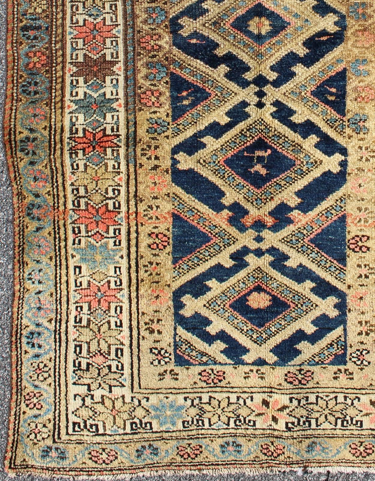 Antique early 20th century Persian Hamadan rug with diamond medallions, rug l11-1203, country of origin / type: Iran / Tribal, circa 1920

This Persian Hamadan rug from early 20th century Iran features five interconnected, diamond-shaped