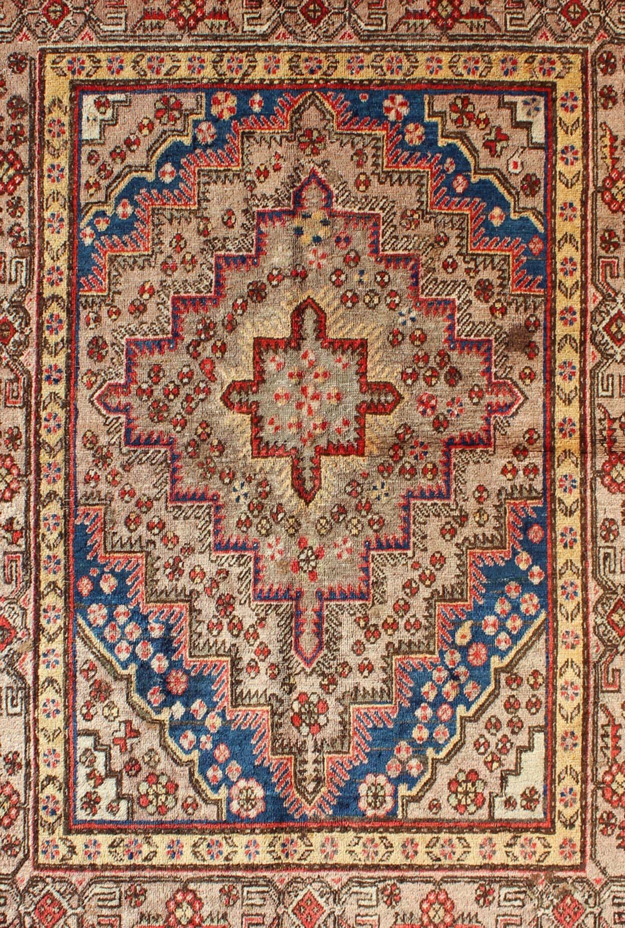 East Turkestani Colorful Antique Khotan Rug With Multi Layered  Medallion Pattern For Sale