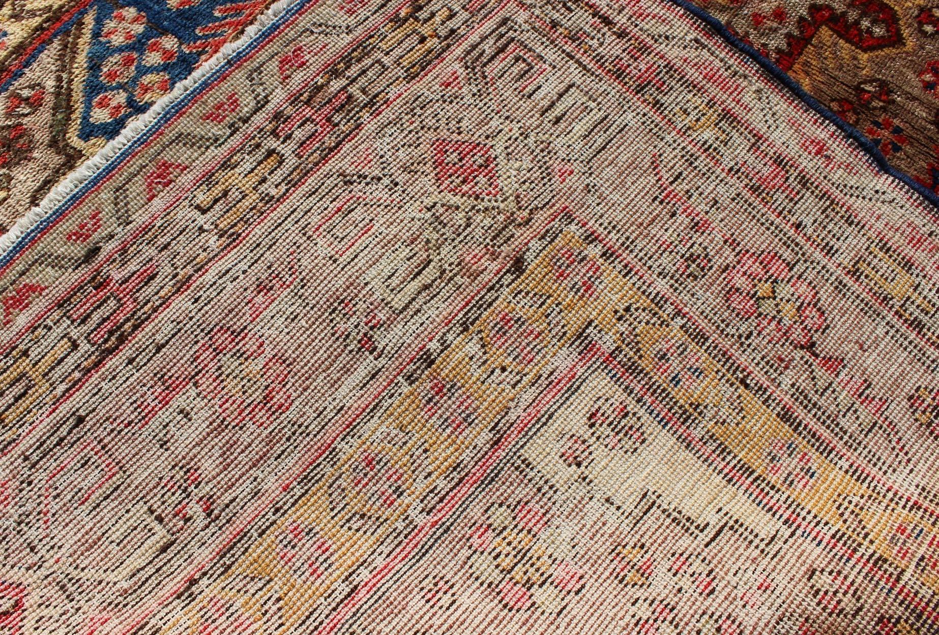 Early 20th Century Colorful Antique Khotan Rug With Multi Layered  Medallion Pattern For Sale