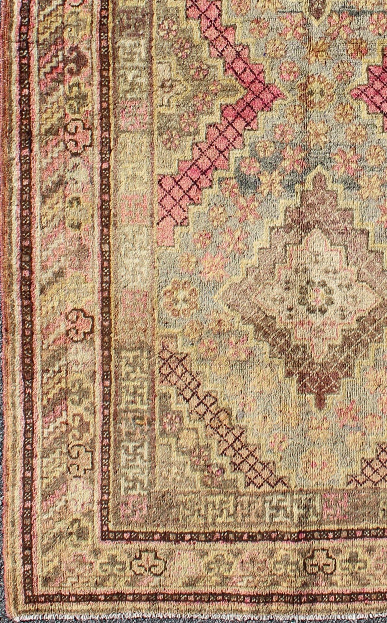 Early 20th century antique Khotan rug with paired diamond medallions in wine red, rug mp-1301-519, country of origin / type: East Turkestan / Khotan, circa 1920

This delicately rendered antique Khotan rug was handcrafted in Turkestan during the
