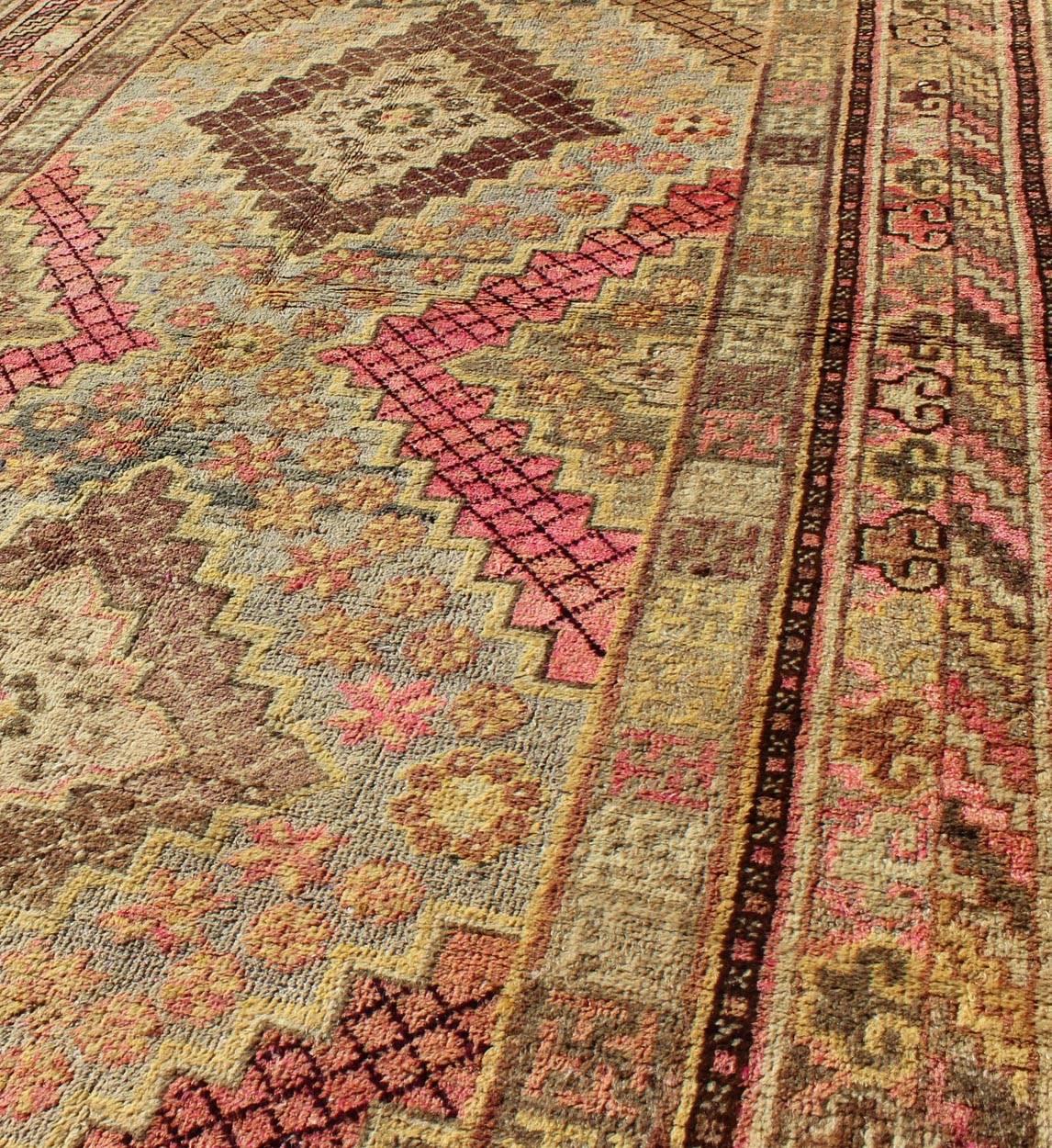 Early 20th Century Antique Khotan Rug with Paired Diamond Medallions in Wine Red In Excellent Condition For Sale In Atlanta, GA