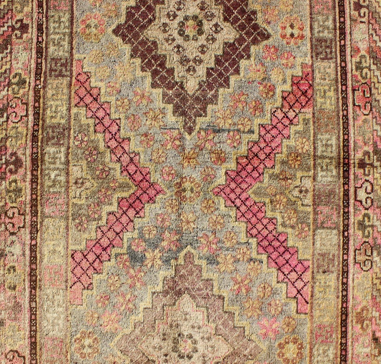 Wool Early 20th Century Antique Khotan Rug with Paired Diamond Medallions in Wine Red For Sale