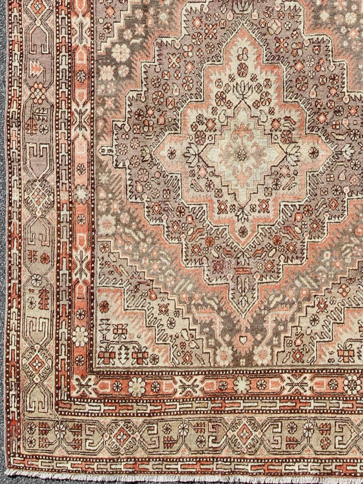 Early 20th century antique Khotan rug with paired medallions in gray and red, rug mp-1610-157264, country of origin / type: East Turkestan / Khotan, circa 1920

This delicately rendered antique Khotan rug was handcrafted in Turkestan during the