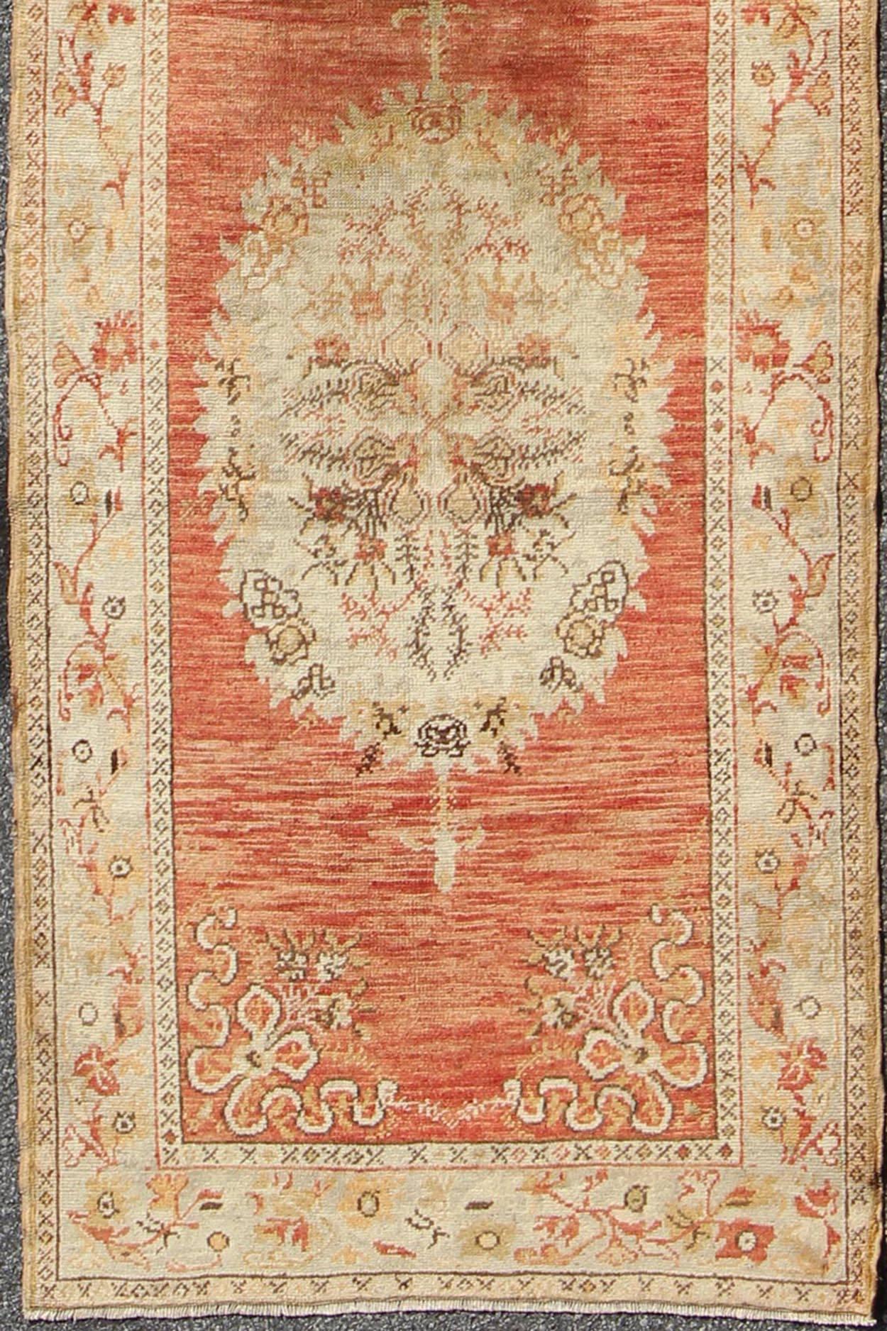 Vintage Turkish Oushak runner with floral medallions in orange red, olive green and cream, rug na-54617, country of origin / type: Turkey / Oushak, circa mid-20th century.

This beautiful vintage Oushak runner from mid-20th century Turkey features a