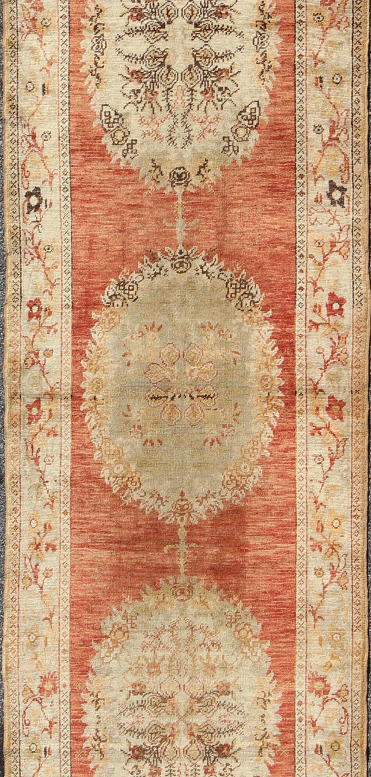 Turkish Oushak Runner With Floral Medallions in Soft Orange Red, Olive Green & Ivory For Sale