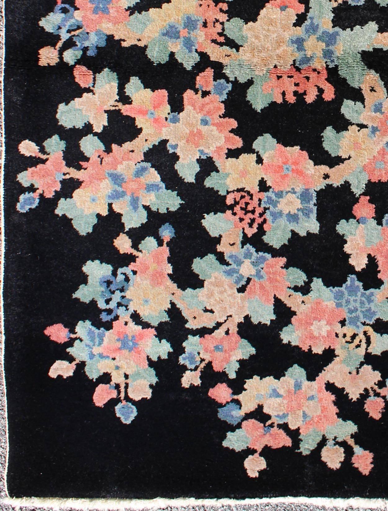 Art Deco Chinese rug with black background and flower bouquet in pastel colors, rug s12-0505, country of origin / type: China / Art Deco, circa 1920

Handwoven in the first part of 20th century (circa 1920), this antique Chinese rug features a