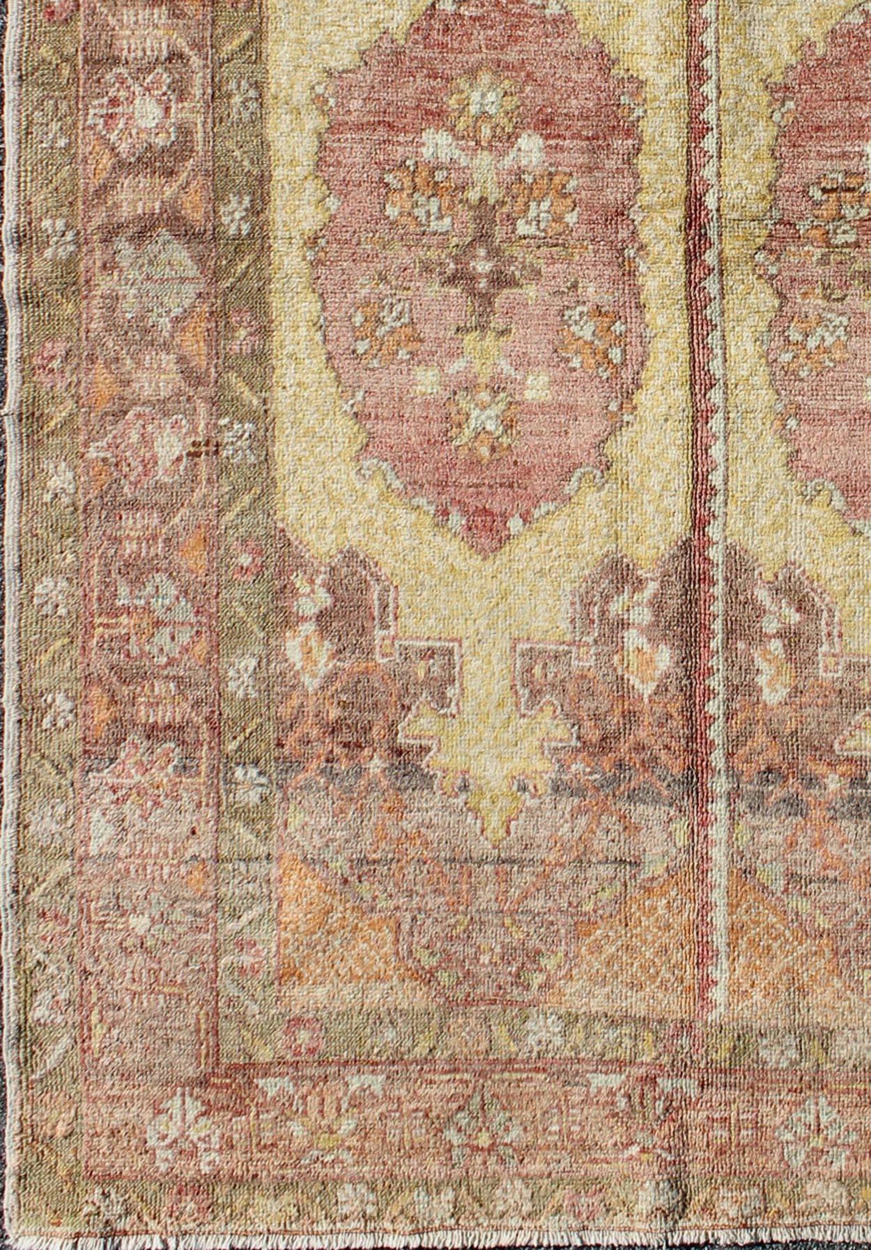 Turkish Oushak Rug with Two Medallion Panels in Yellow, Brown, Orange and Soft Red For Sale