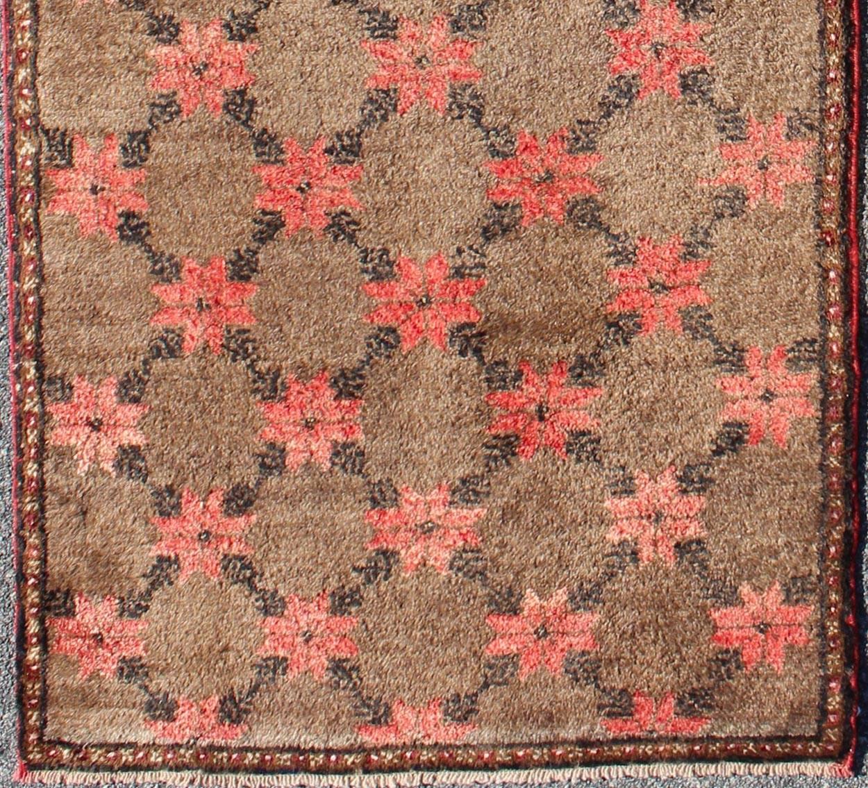 Turkish Tulu runner with Poinsettias design in brown, charcoal, red and ivory, Keivan Woven Arts / rug EN-112936, country of origin / type: Turkey / Tulu, circa mid-20th century

This unique Turkish Tulu runner features an all-over design of vibrant