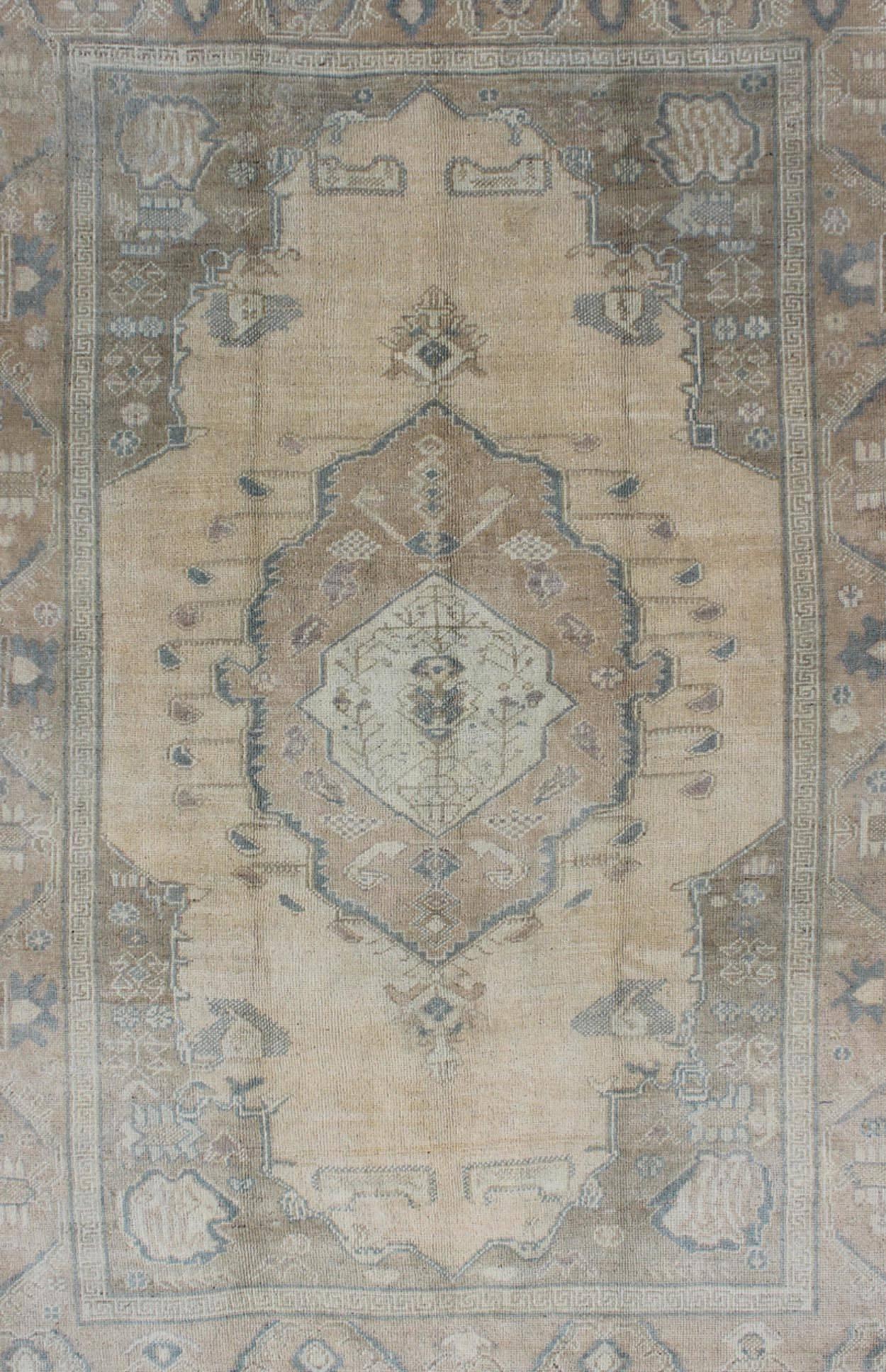 Hand-Knotted Vintage Turkish Oushak Rug with Tribal Medallion in Ivory, Camel, and Gray For Sale