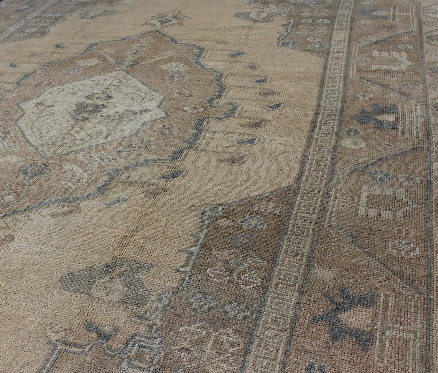 20th Century Vintage Turkish Oushak Rug with Tribal Medallion in Ivory, Camel, and Gray For Sale