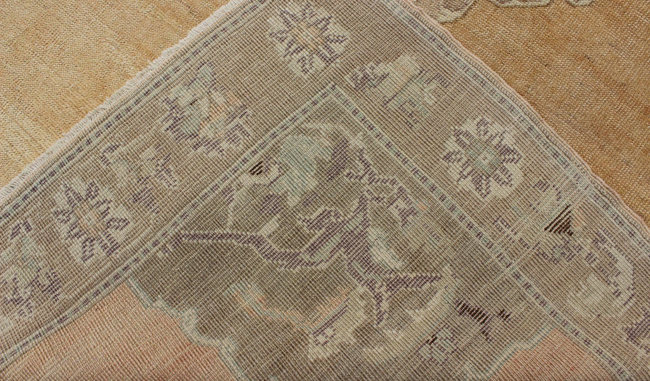 Vintage Turkish Oushak Rug with Floral Medallion in Faded Orange and Light Brown 1