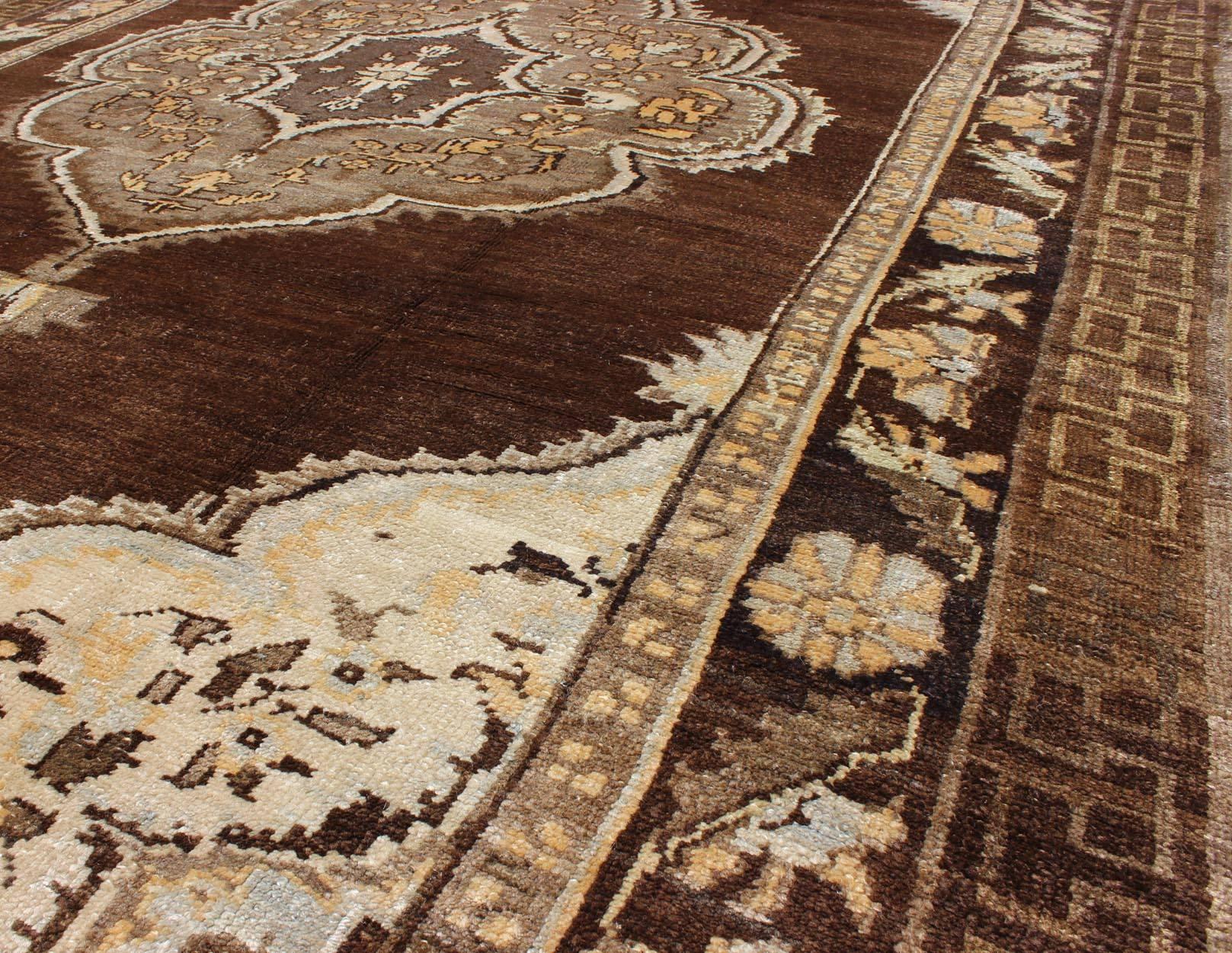 Brown Background Floral Medallion Vintage Turkish Kars Rug in Ivory and Taupe In Excellent Condition For Sale In Atlanta, GA