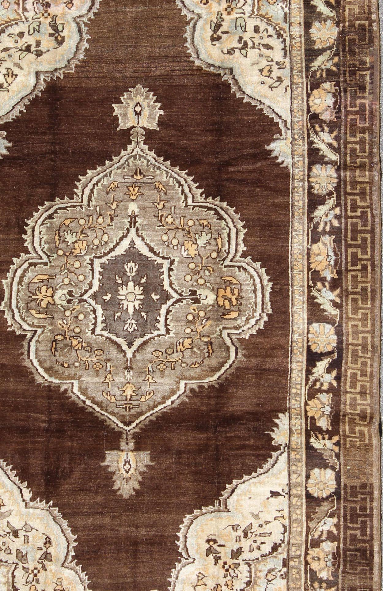 Hand-Knotted Brown Background Floral Medallion Vintage Turkish Kars Rug in Ivory and Taupe For Sale