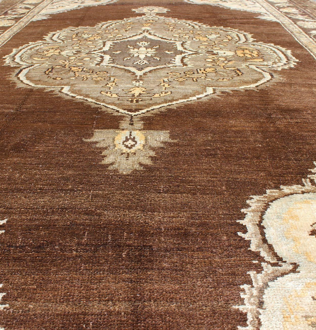 20th Century Brown Background Floral Medallion Vintage Turkish Kars Rug in Ivory and Taupe For Sale