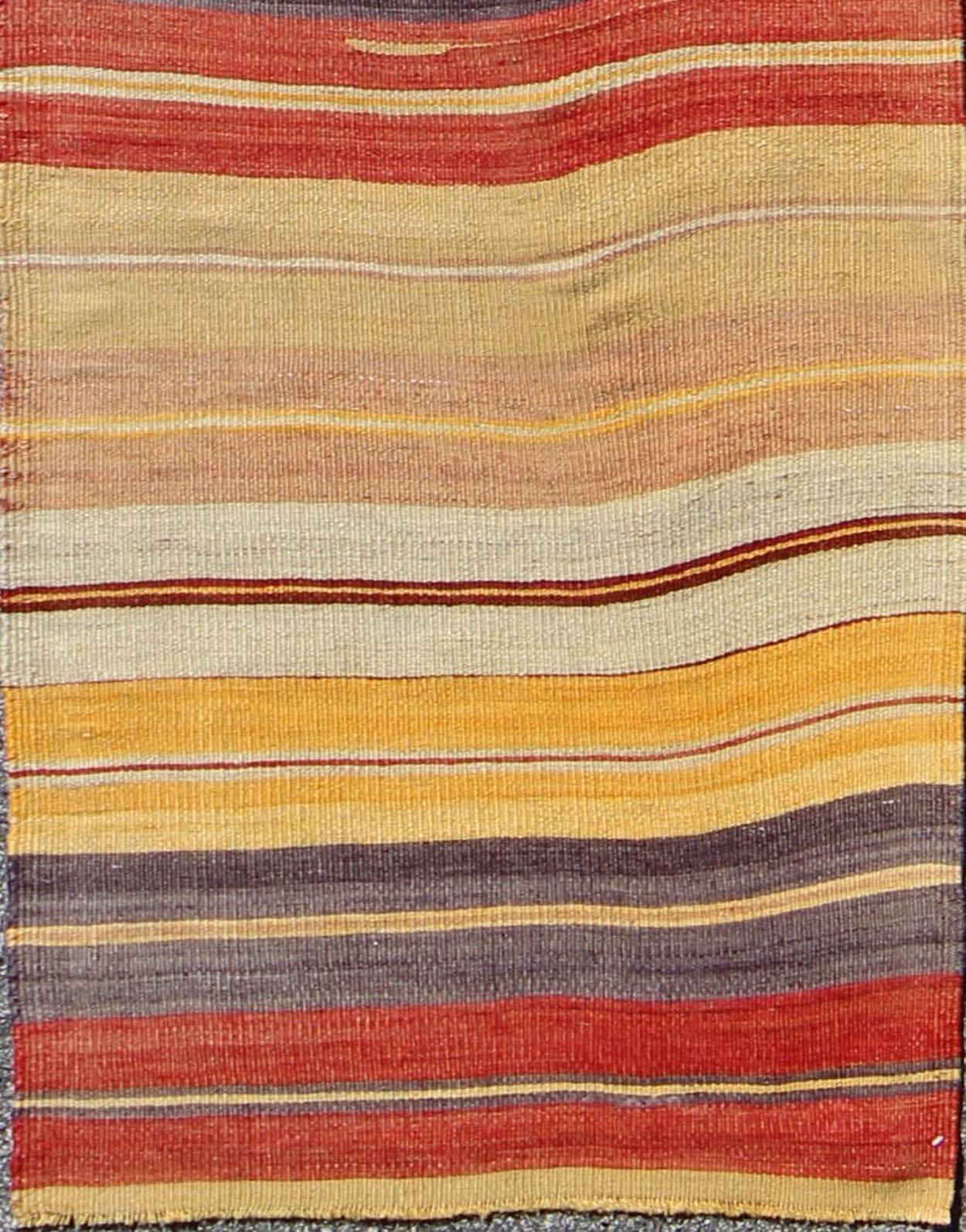 Colorful vintage Turkish Kilim rug with horizontal stripe design, rug en-775, country of origin / type: Turkey / Kilim, circa mid-20th century.

Featuring a repeating horizontal stripe design, this unique midcentury kilim showcases an array of