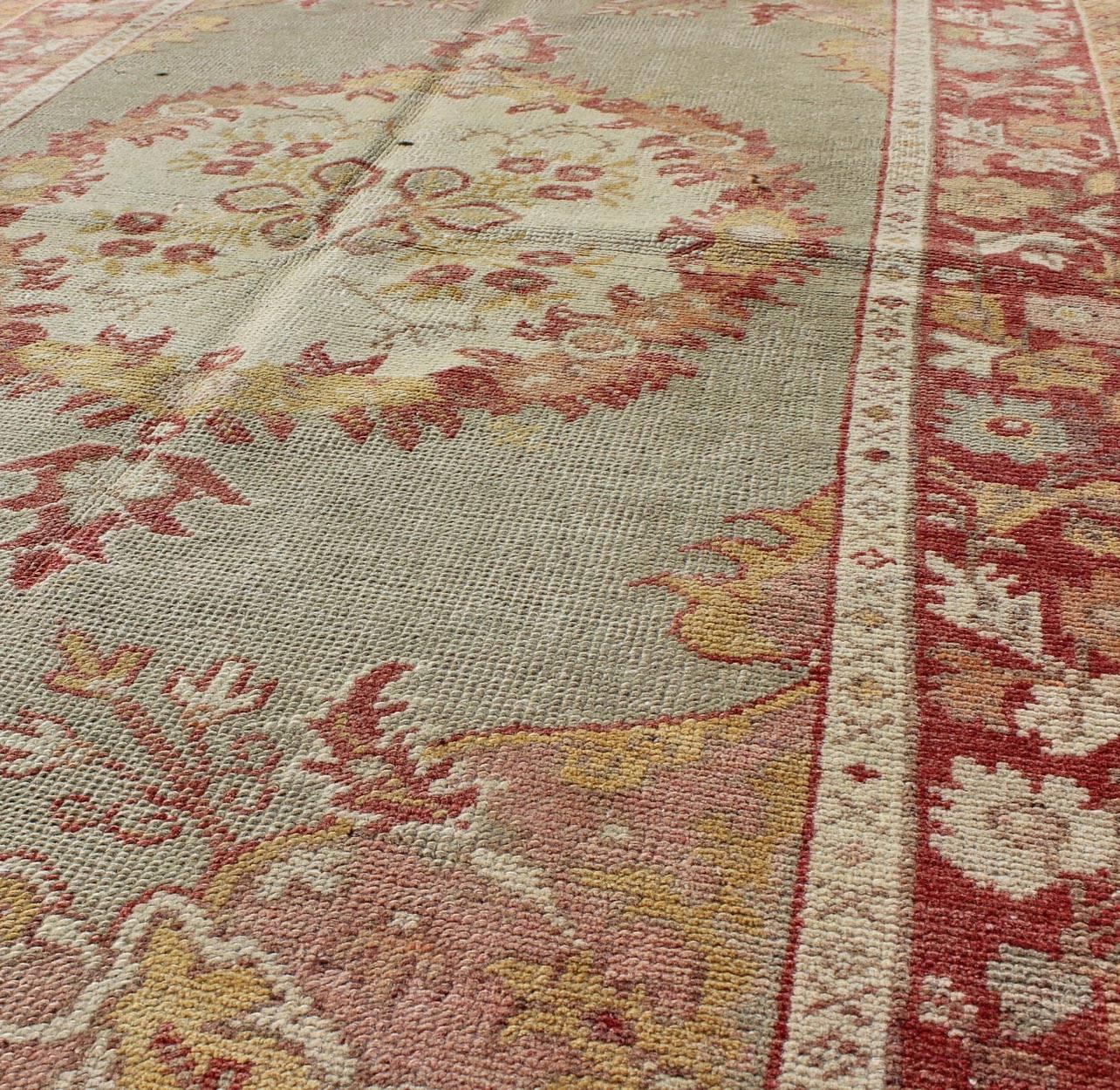 20th Century Turkish Oushak Vintage Rug with Floral Medallion Design in Red and Light Blue For Sale