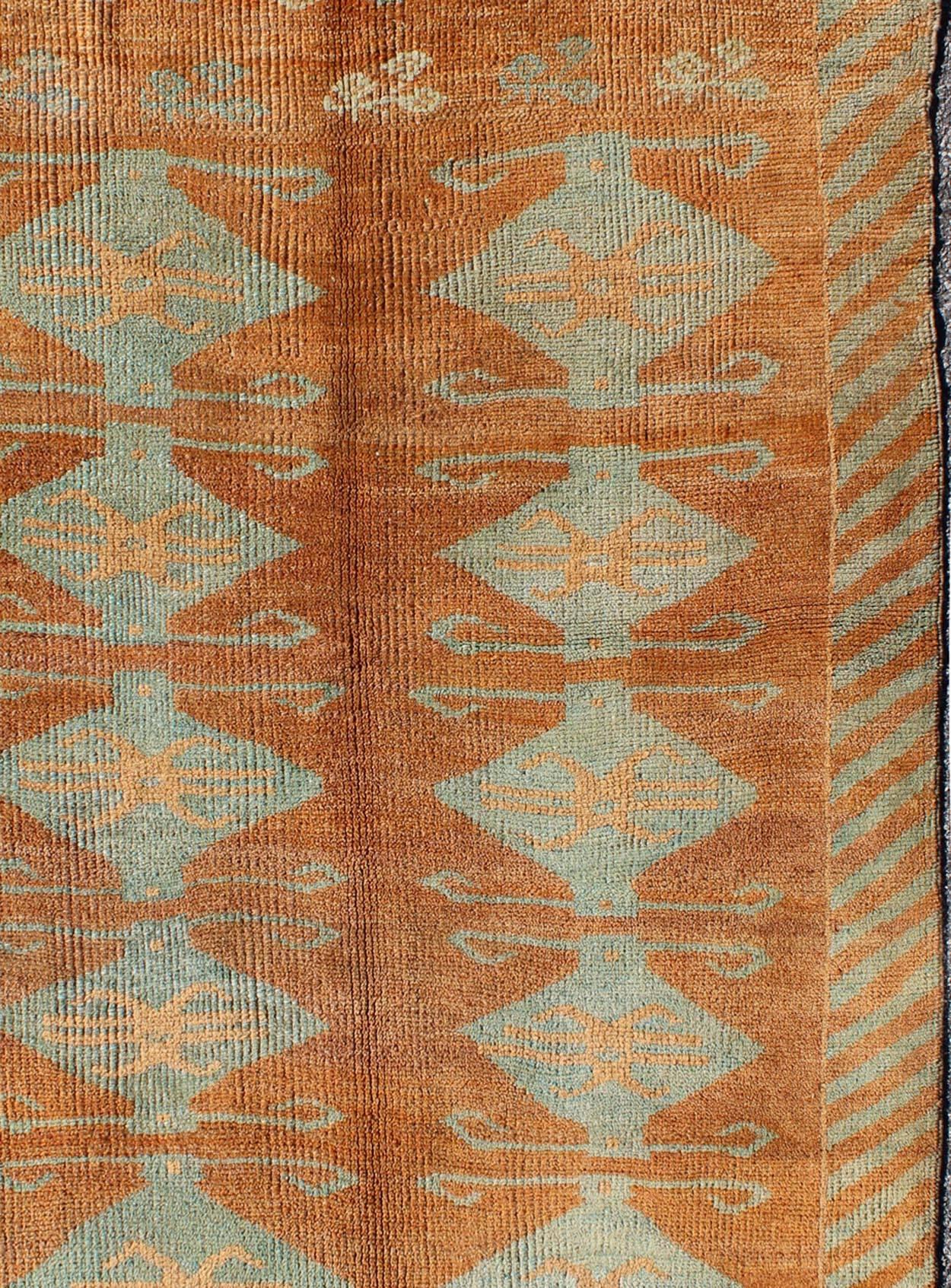 Hand-Knotted Antique Turkish Tulu Rug with Tribal Medallions in Copper and Light Blue green For Sale