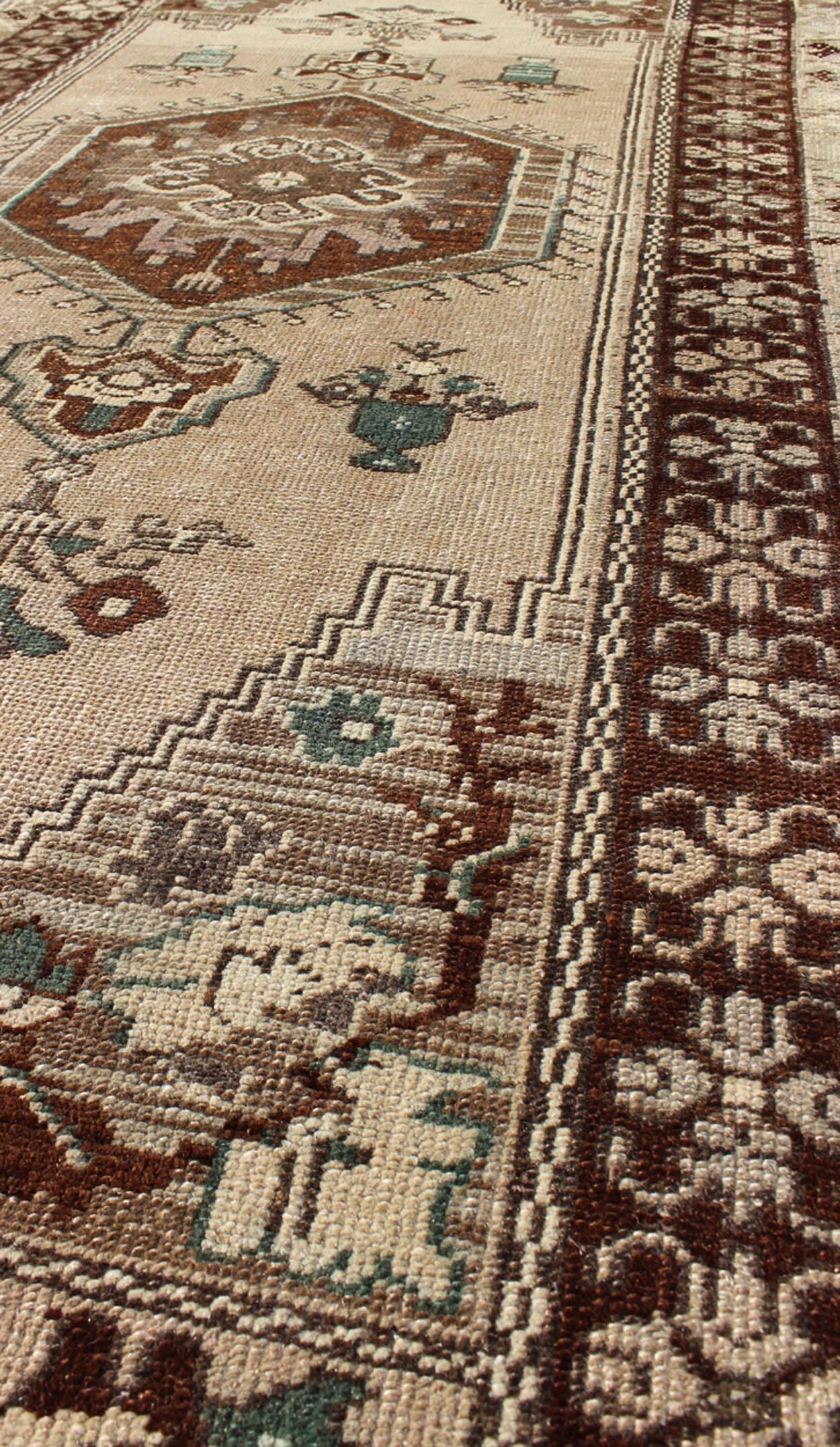20th Century Turkish Oushak Vintage Rug with Central Medallion and Floral Motifs in Brown For Sale