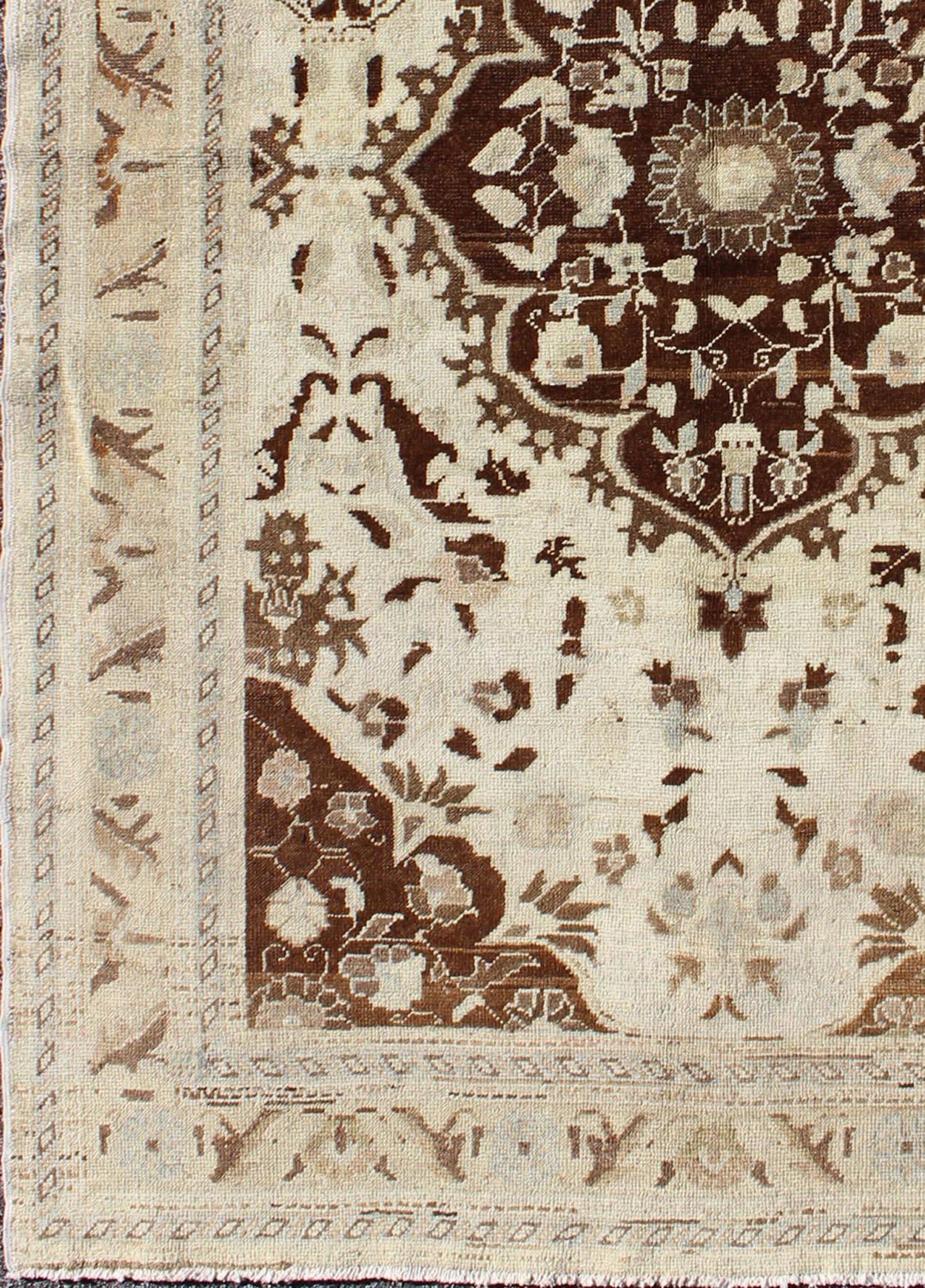 Turkish Oushak vintage rug with intricate floral medallion in brown and ivory, rug ayd-95077, country of origin / type: Turkey / Oushak, circa mid-20th century.

This vintage Turkish Oushak carpet (circa mid-20th century) features a central