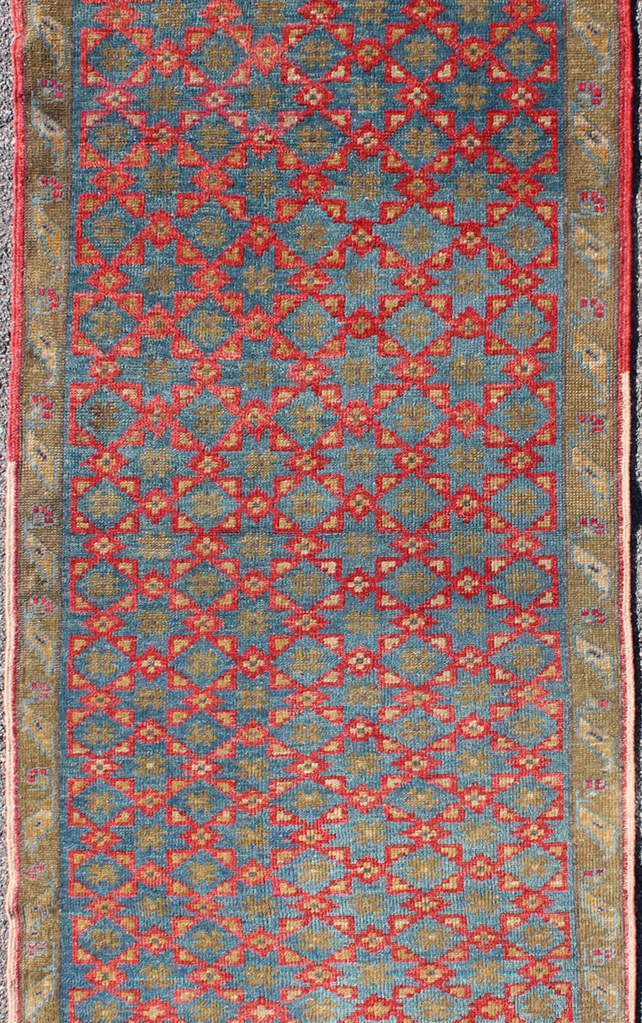 Hand-Knotted Turkish Konya Rug with All-Over Floral Lattice Design in Red, Blue, Olive Green For Sale