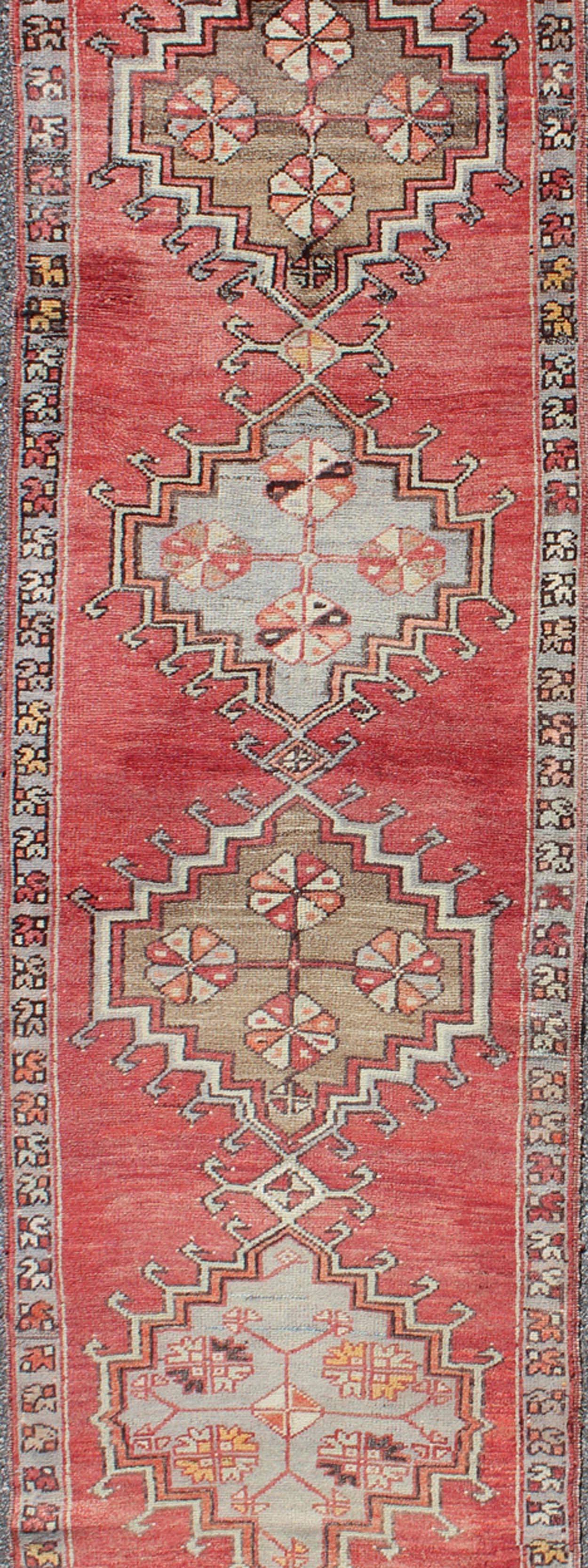 Hand-Knotted Tribal Geometric Vintage Turkish Oushak Runner with Medallions on Red Background