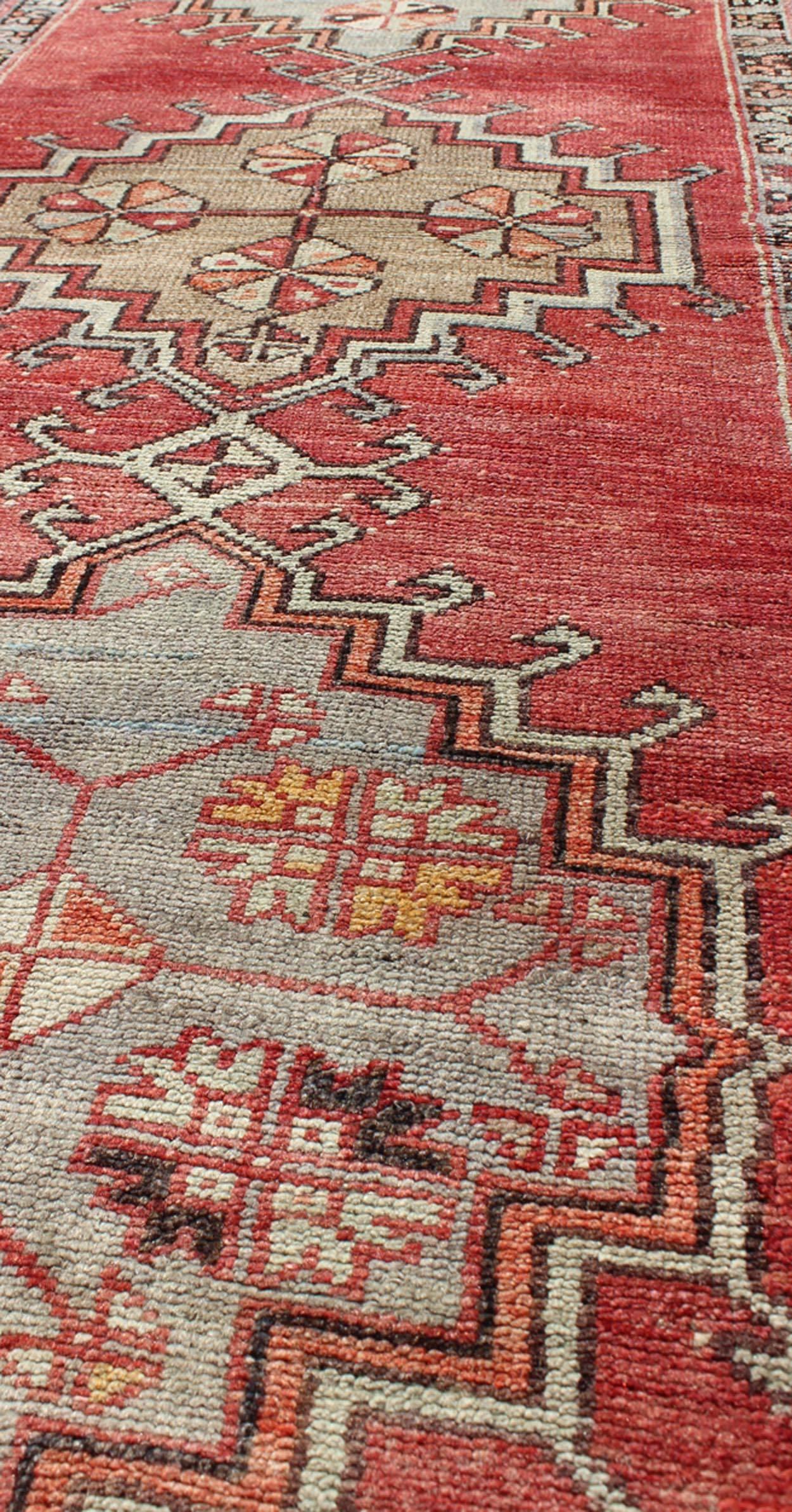 20th Century Tribal Geometric Vintage Turkish Oushak Runner with Medallions on Red Background