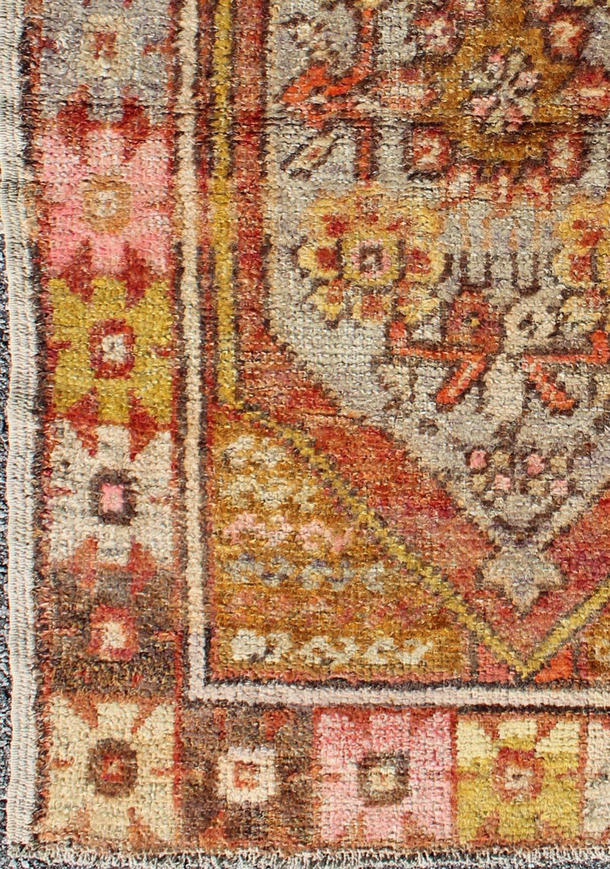 Colorful vintage Turkish Small Oushak with floral medallion and border, Keivan Woven Arts, rug #DUR-3457, country of origin / type: Turkey / Oushak, circa mid-20th century

Measures: 2.8 x 4.1

This small vintage Turkish Oushak carpet (circa
