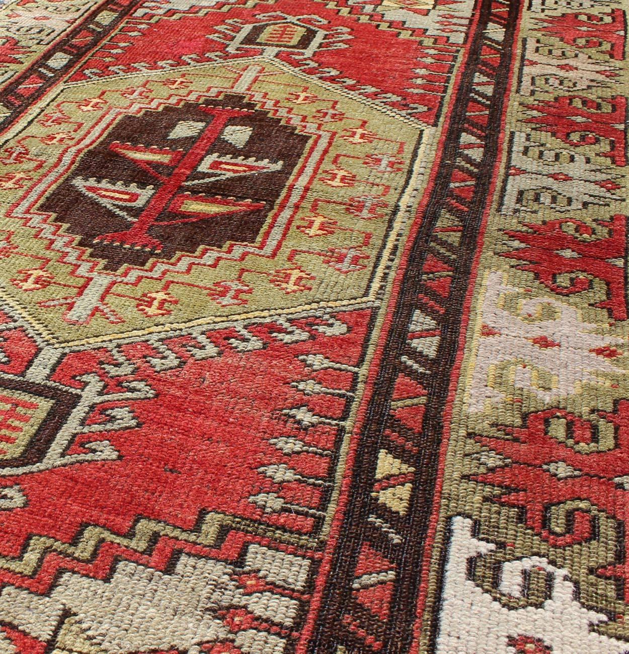 20th Century Vintage Turkish Oushak Rug with Geometric Tribal Medallion in Red and Green For Sale