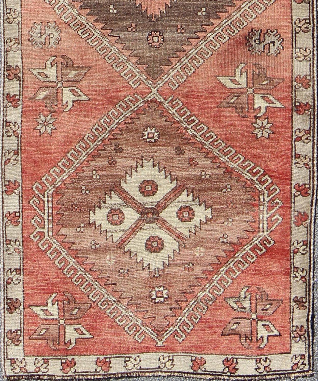 Geometric vintage Turkish Oushak runner with Medallions in red and brown, rug dur-502, country of origin / type: Turkey / Oushak, circa mid-20th century

This vintage Turkish Oushak gallery rug (circa mid-20th century) features a unique blend of