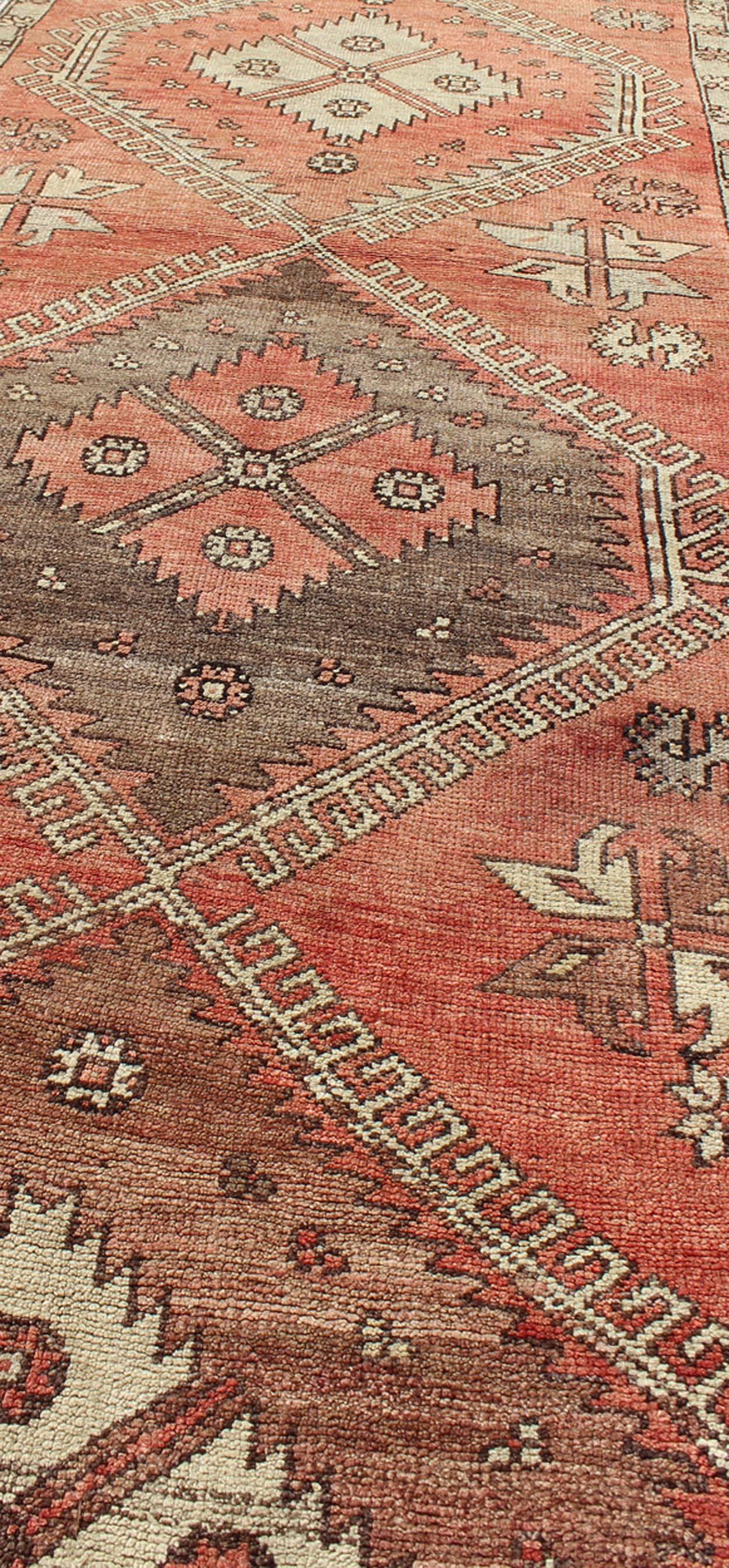 20th Century Geometric Vintage Turkish Oushak Runner with Medallions in Red and Brown For Sale