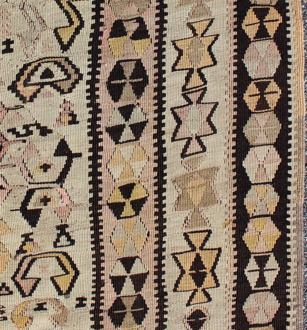 20th Century Vintage Turkish Kilim Gallery Rug with Tribal Design in Brown, Pink and Yellow For Sale