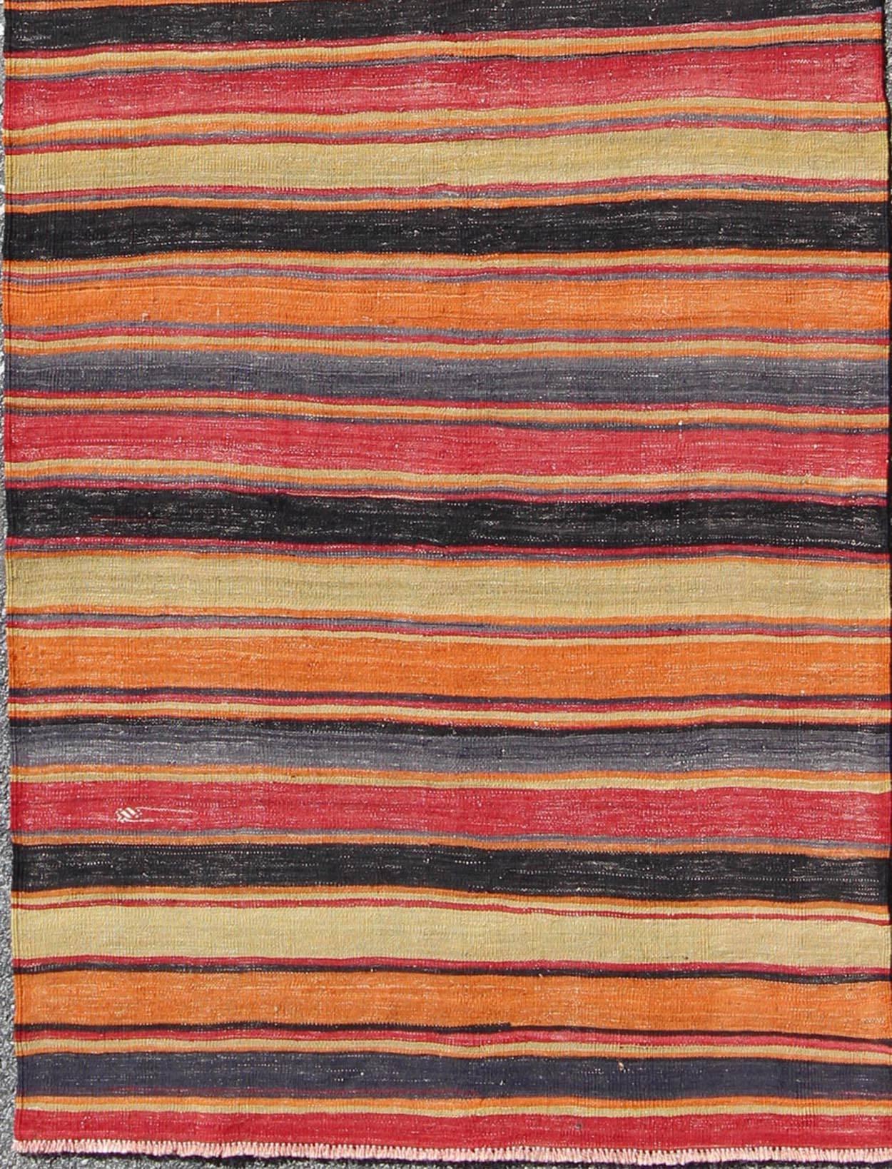 Multicolored Vintage Turkish Kilim rug with Horizontal Stripe Design, rug emd-95026, country of origin / type: Turkey / Kilim, circa mid-20th century

Featuring a repeating horizontal stripe design, this unique midcentury Kilim showcases an array