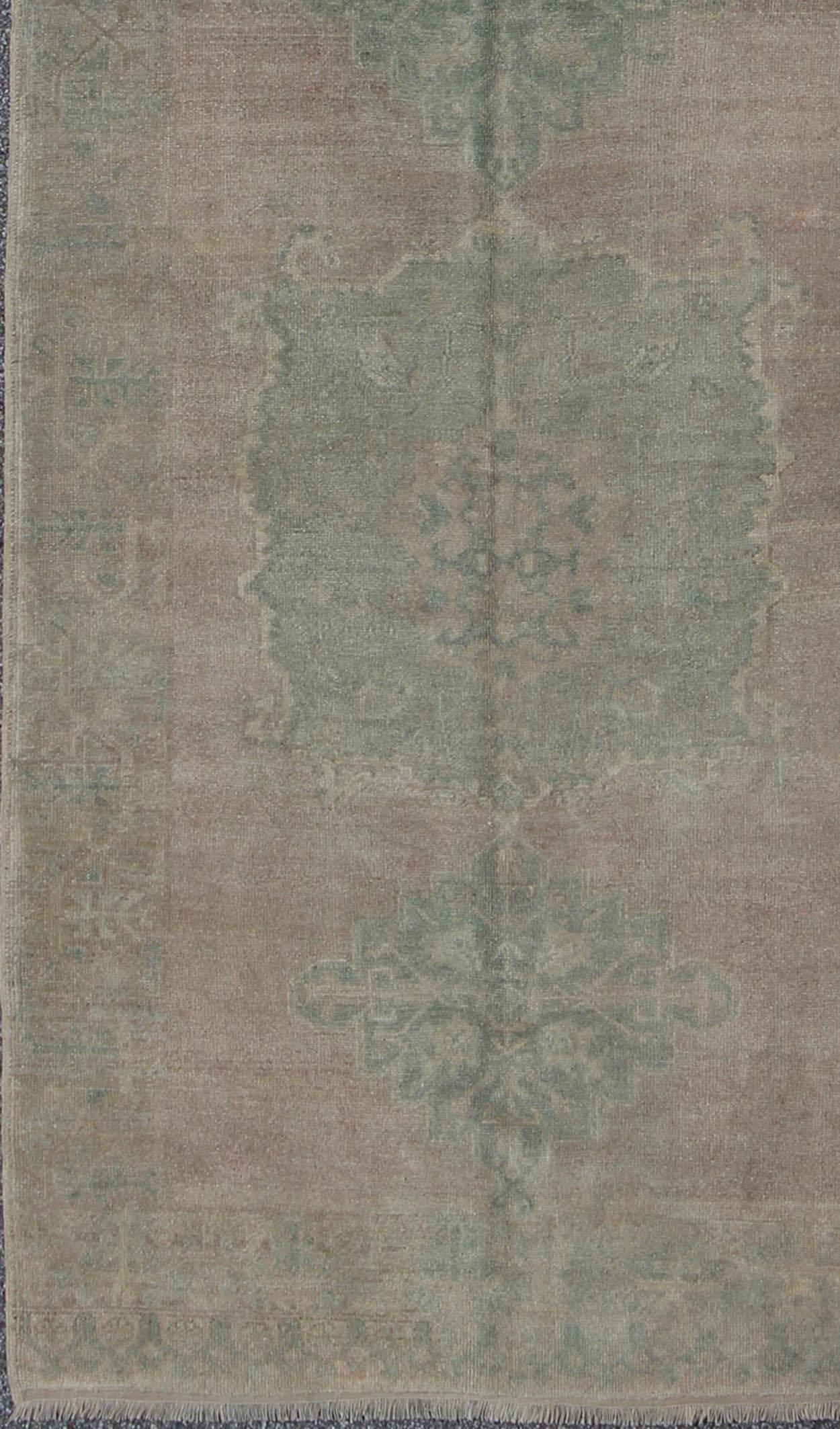 Faded Vintage Turkish Oushak runner with dual-medallion in lavender and green, rug fah-95192 , country of origin / type: Turkey / Oushak, circa mid-20th century

This faded Turkish runner features a dual central medallion design as well as