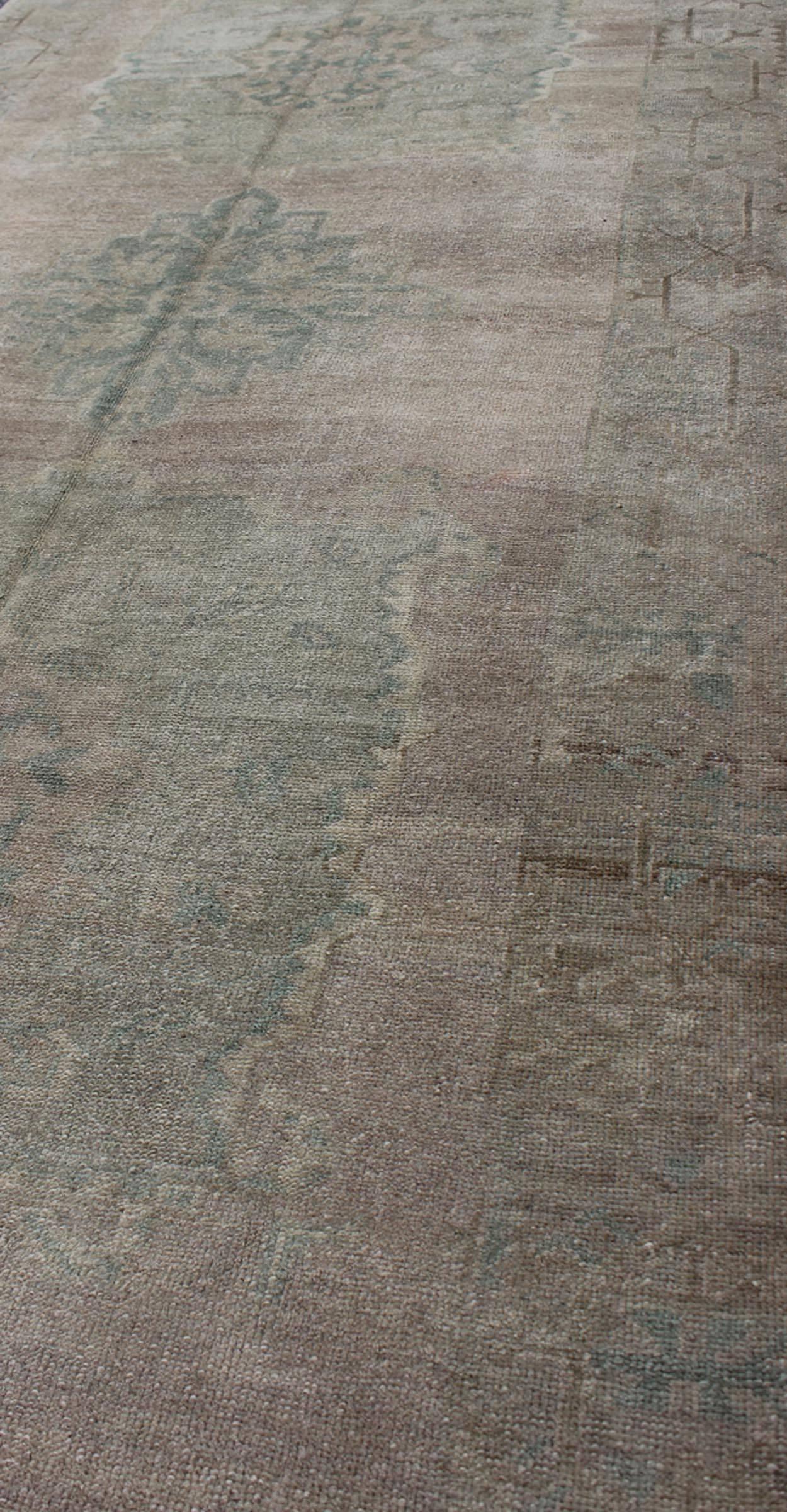 20th Century Faded Vintage Turkish Oushak Runner with Dual-Medallion in Lavender and Green For Sale