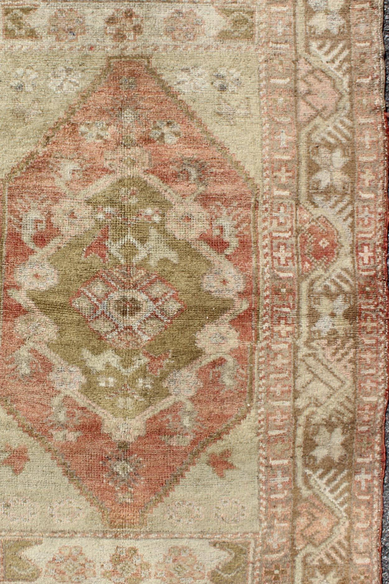 Hand-Knotted Oushak Vintage from Turkey Rug with Central Medallion in Green, Coral & Salmon For Sale