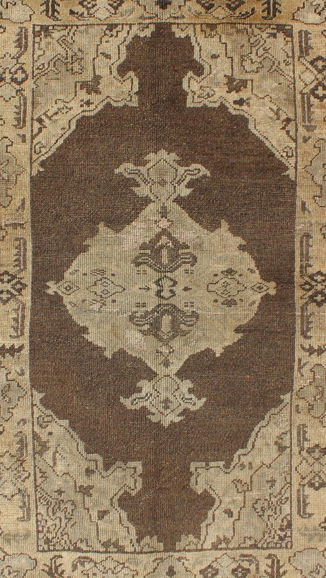 Hand-Knotted Chocolate Background Vintage Turkish Oushak Rug with Floral Medallion in Cream For Sale