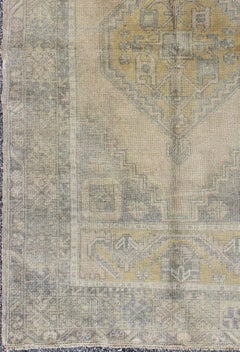 Muted Mid-Century Turkish Oushak Rug with Tribal Geometric Medallion Design