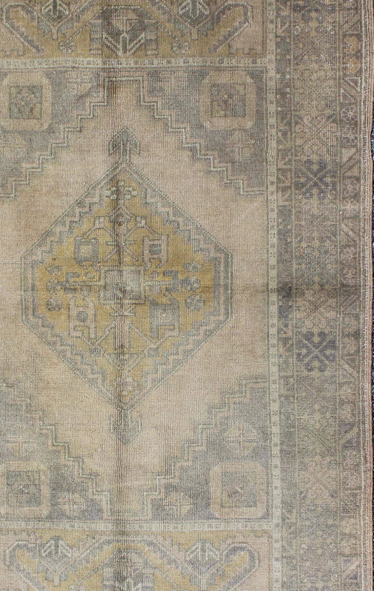 Muted Mid-Century Turkish Oushak Rug with Tribal Geometric Medallion Design In Excellent Condition In Atlanta, GA