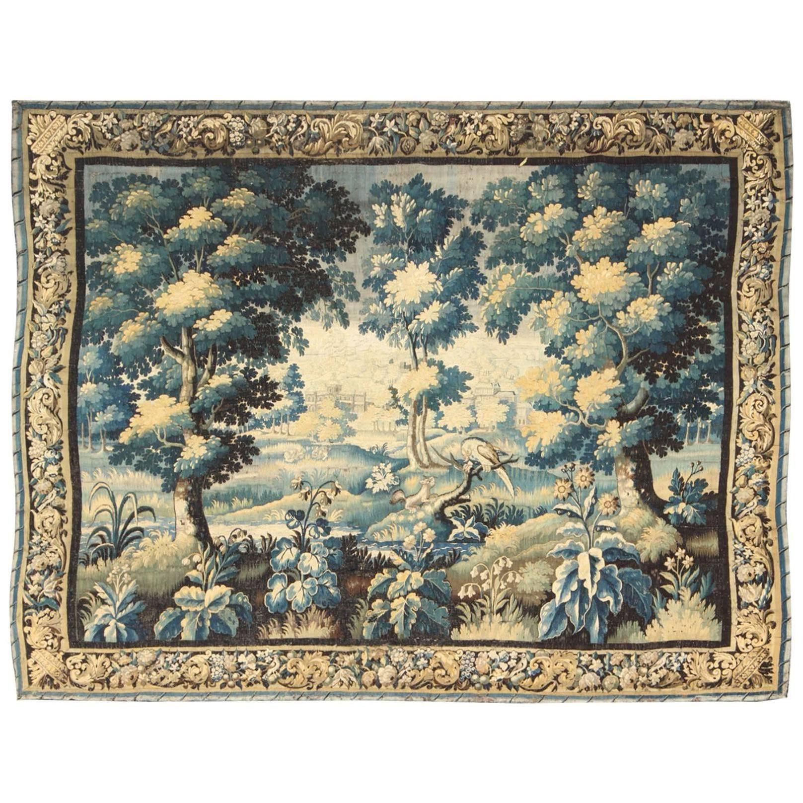 17th Century Antique Tapestry with Woodland Scene and Floral Border in Blue Tone