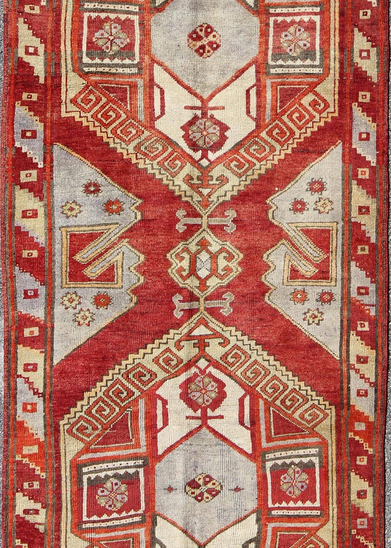 Hand-Knotted Red Mid-Century Vintage Turkish Oushak Rug with Geometric Dual Medallions For Sale