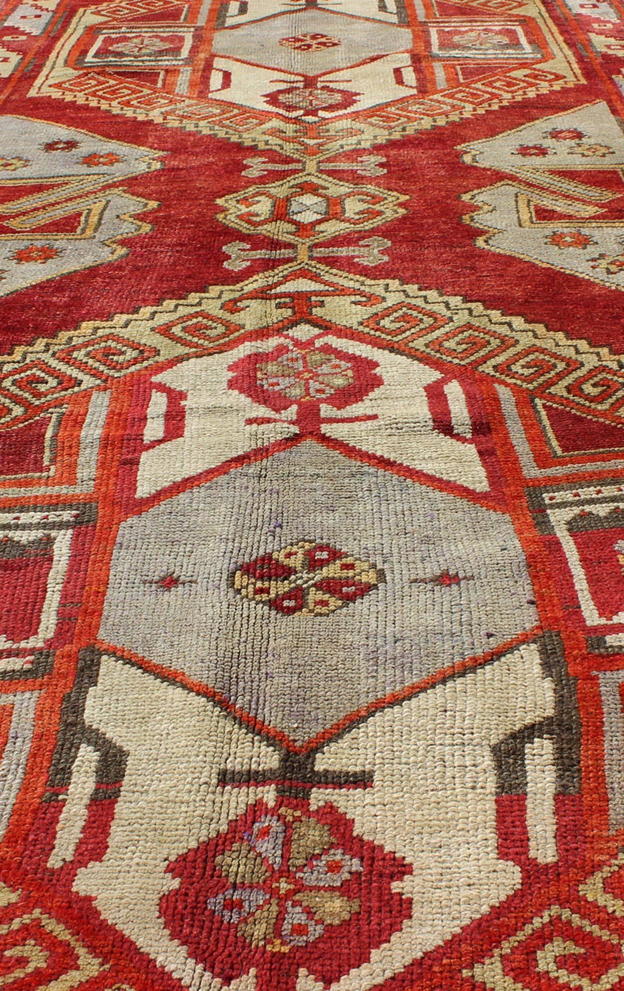Wool Red Mid-Century Vintage Turkish Oushak Rug with Geometric Dual Medallions For Sale